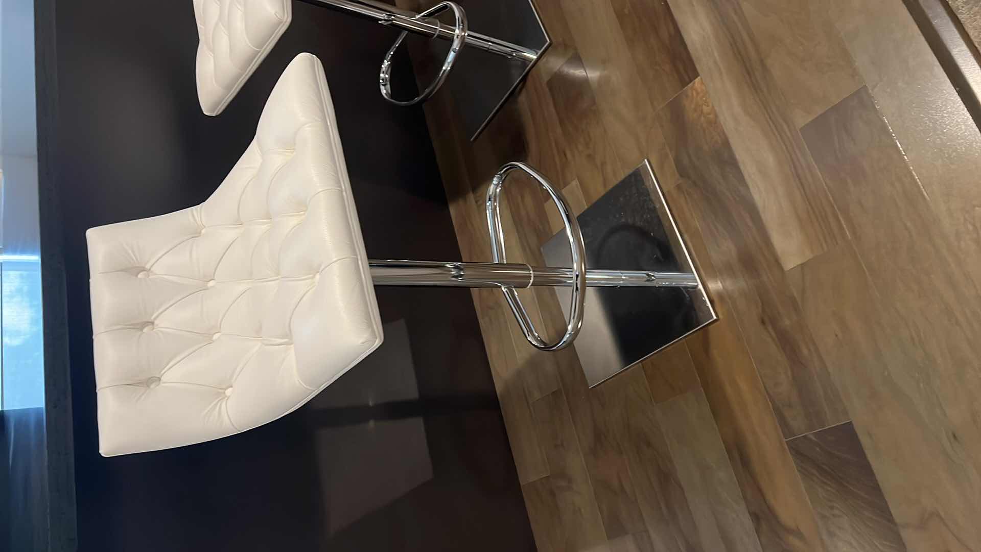 Photo 2 of DESIGNER WHITE LEATHER ADJUSTABLE ARMLESS SWIVEL UP AND DOWN BAR STOOL W SILVER BASE