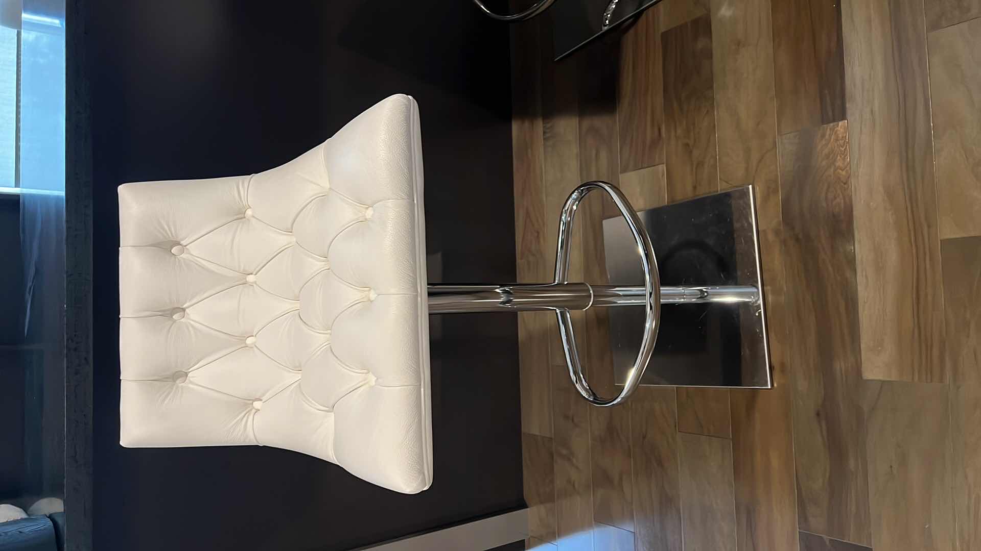 Photo 1 of DESIGNER WHITE LEATHER ADJUSTABLE ARMLESS SWIVEL UP AND DOWN BAR STOOL W SILVER BASE