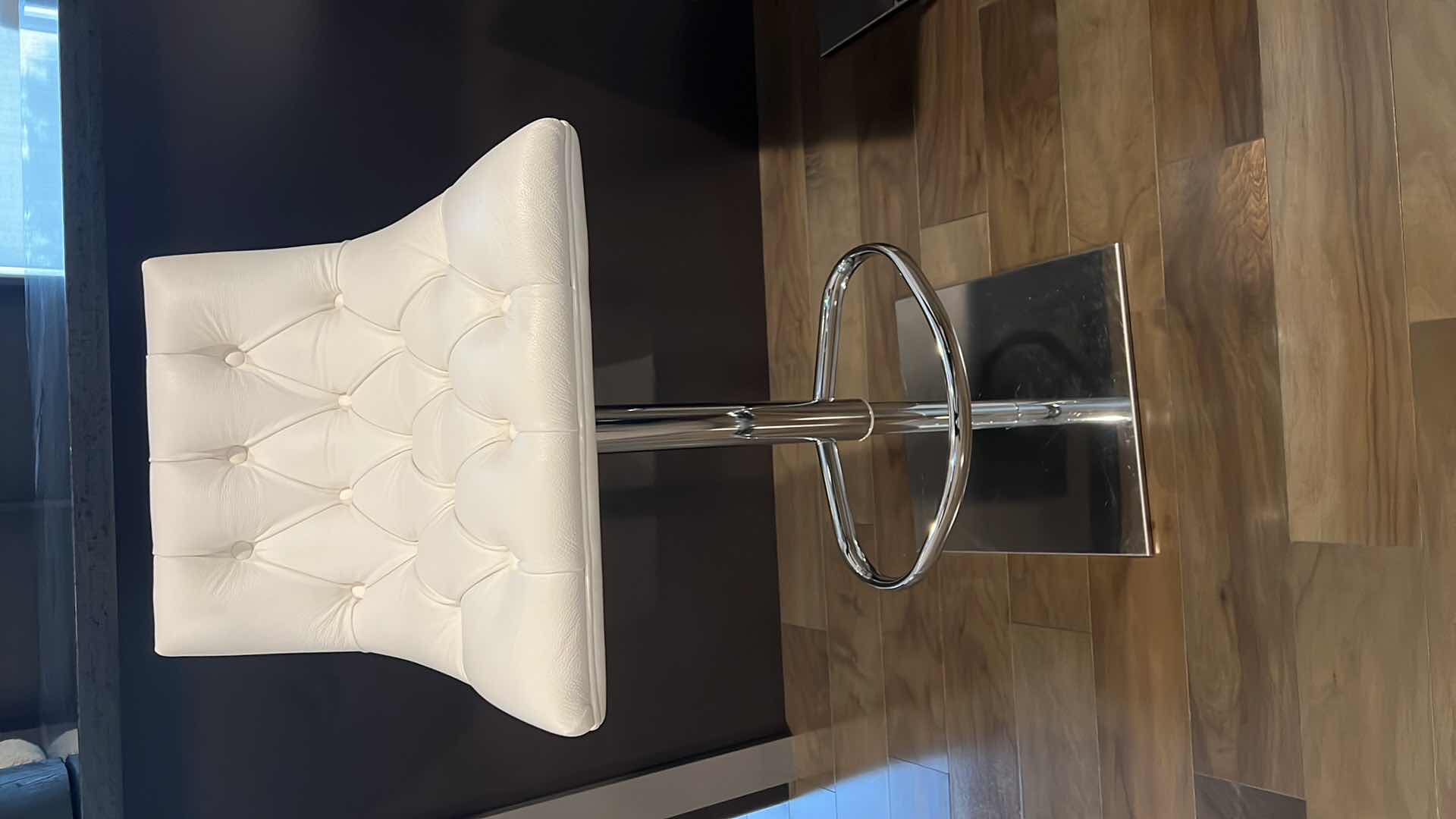 Photo 1 of DESIGNER WHITE LEATHER ADJUSTABLE ARMLESS UP AND DOWN SWIVEL BAR STOOL W SILVER BASE