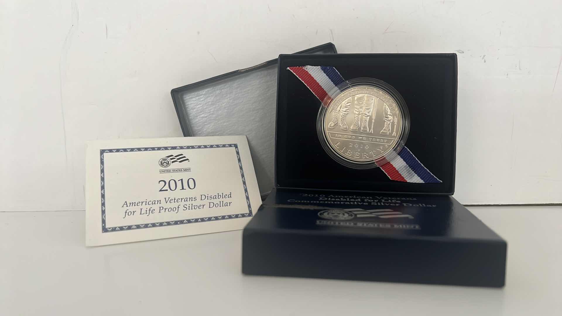 Photo 1 of 2010 AMERICAN VETERAN DISABLED FOR LIFE COMMEMORATIVE SILVER DOLLR -UNITED STATES MINT