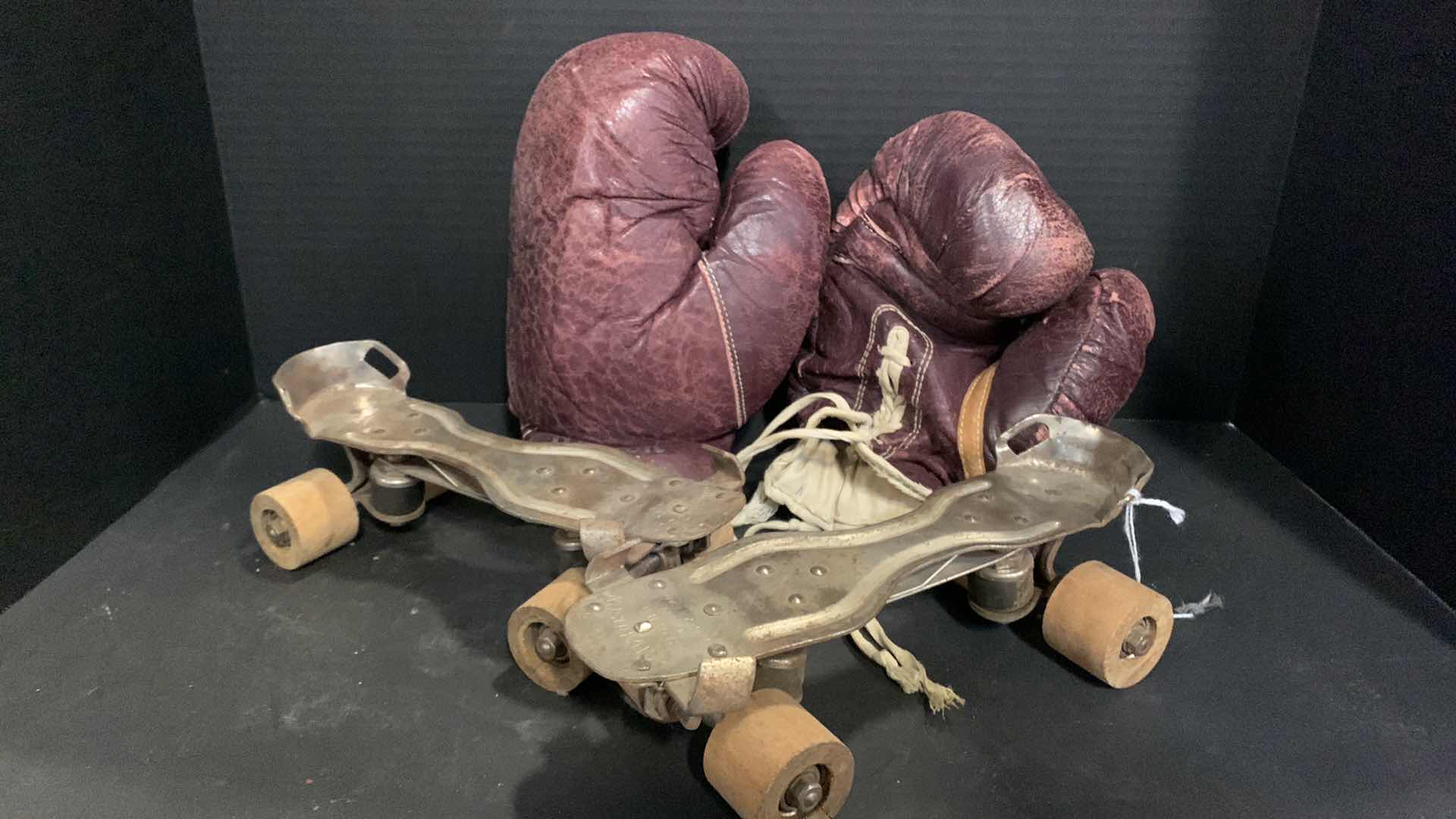 Photo 1 of VINTAGE LEATHER BOXING GLOVES, METAL ROLLER SKATES