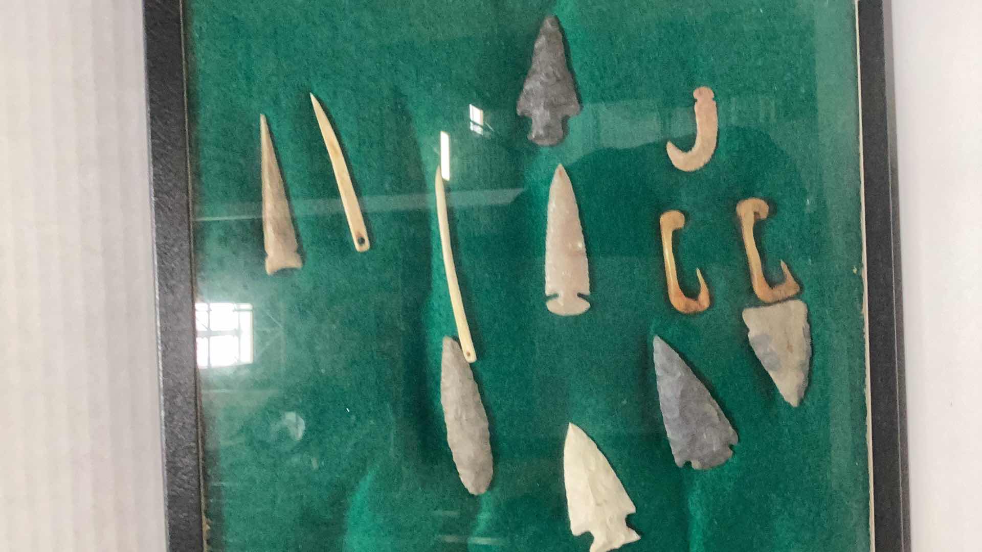 Photo 3 of RARE ANTIQUE NAVAHO MISCELLANEOUS HUNTING ITEMS. CIRCA 1600 B.C. ARROWHEADS, NEEDLES, AND FISH HOOKS CASE 12” X 17”