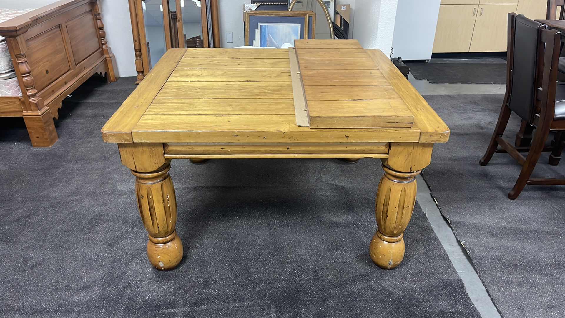 Photo 2 of HEAVY WOOD SLATE TOP TABLE W ONE EXTENSION LEAF 50” X 70” H30”