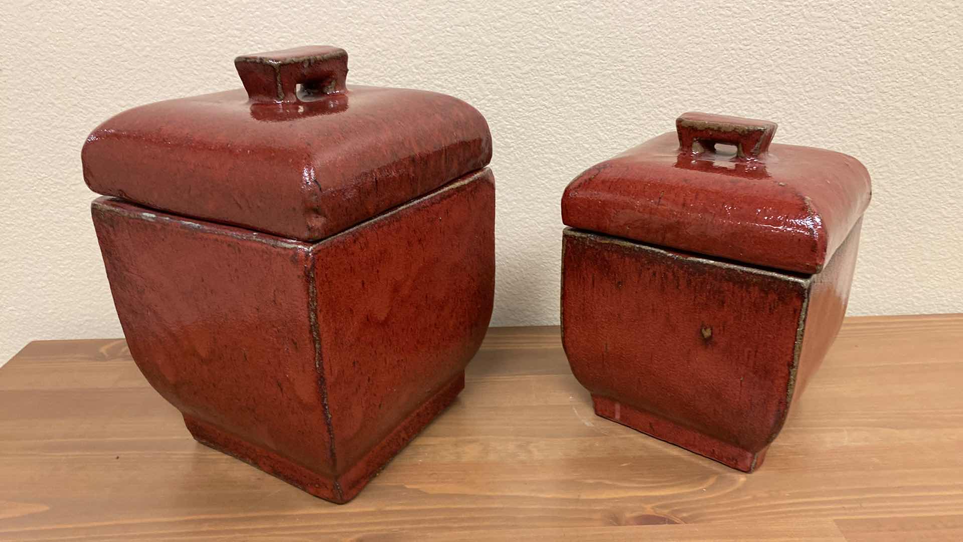 Photo 1 of PAIR OF GLAZED RED POTTERY CANNISTERS LARGEST 8” X 12”