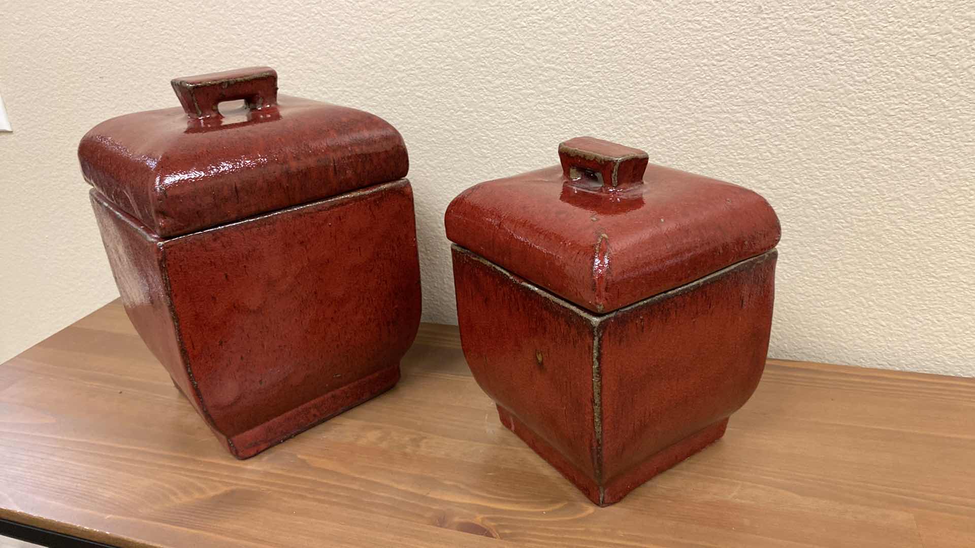 Photo 2 of PAIR OF GLAZED RED POTTERY CANNISTERS LARGEST 8” X 12”