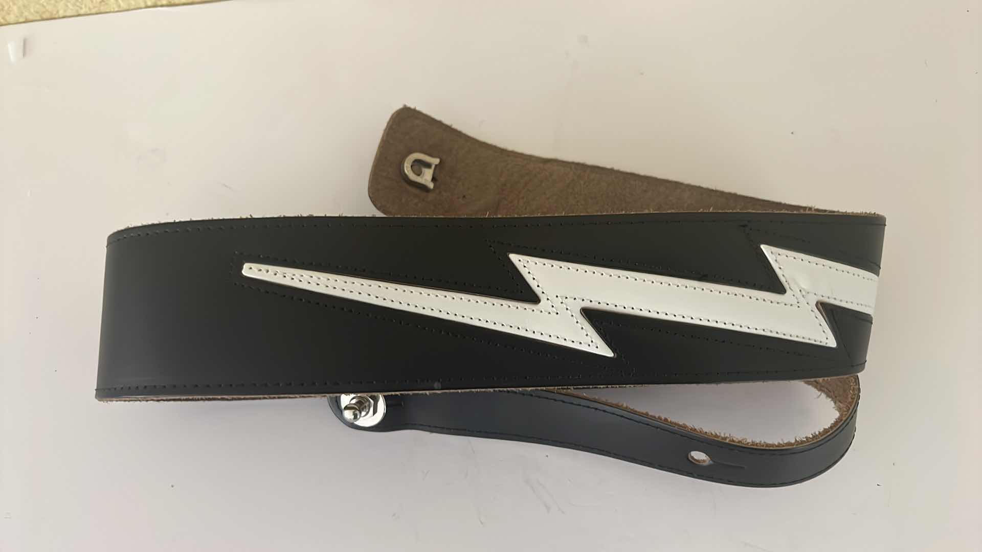 Photo 1 of BLACK LEATHER W WHITE LIGHTENING BOLT MADE IN GERMANY GUITAR STRAP