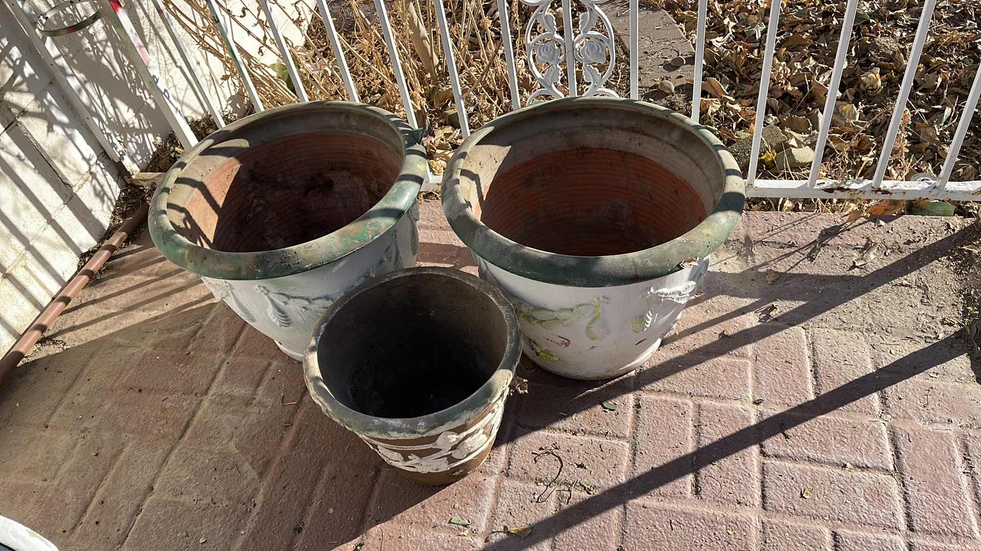 Photo 2 of TERRACOTTA 
PLANTERS AND SMALLER ONE RESIN