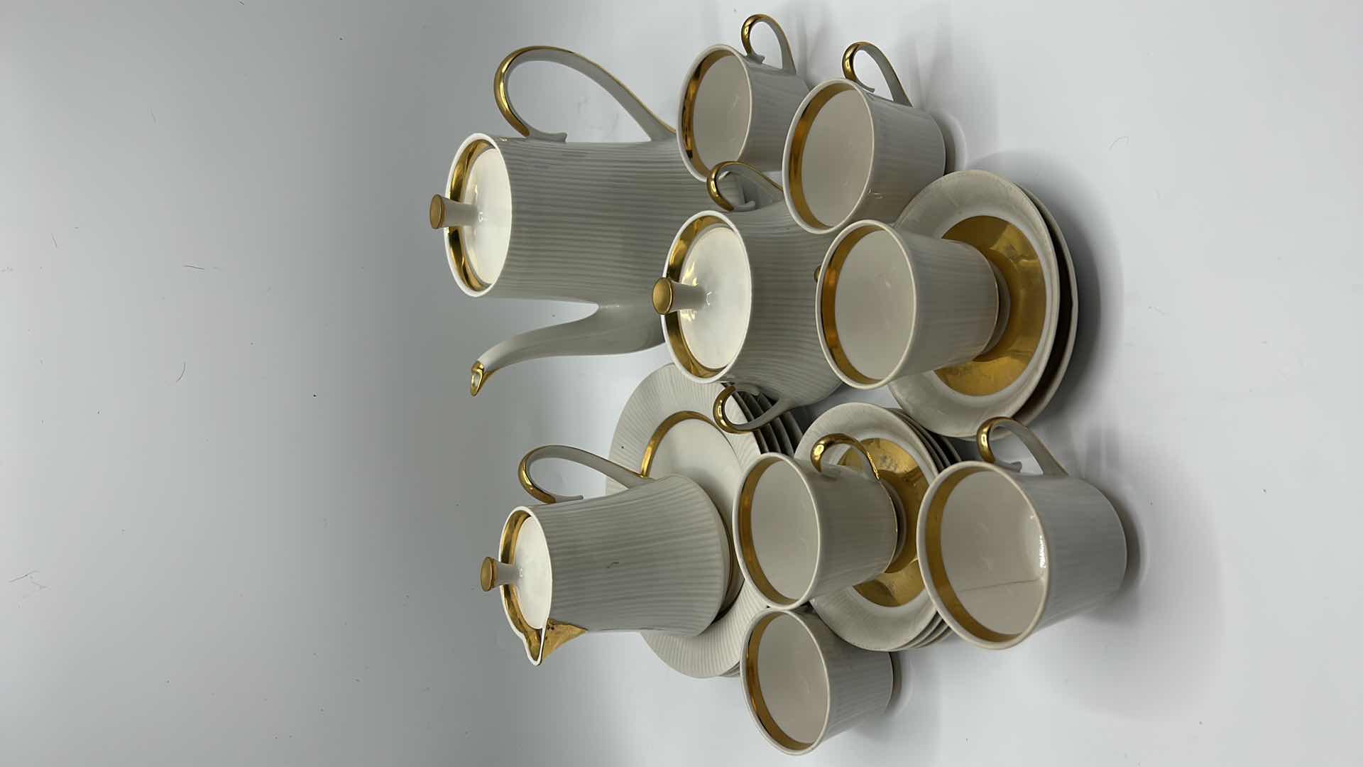 Photo 2 of VINTAGE 23 PIECE WHITE AND GOLD TRIMMED PORCELAIN EXPRESSO/TEA SET SIGNED W