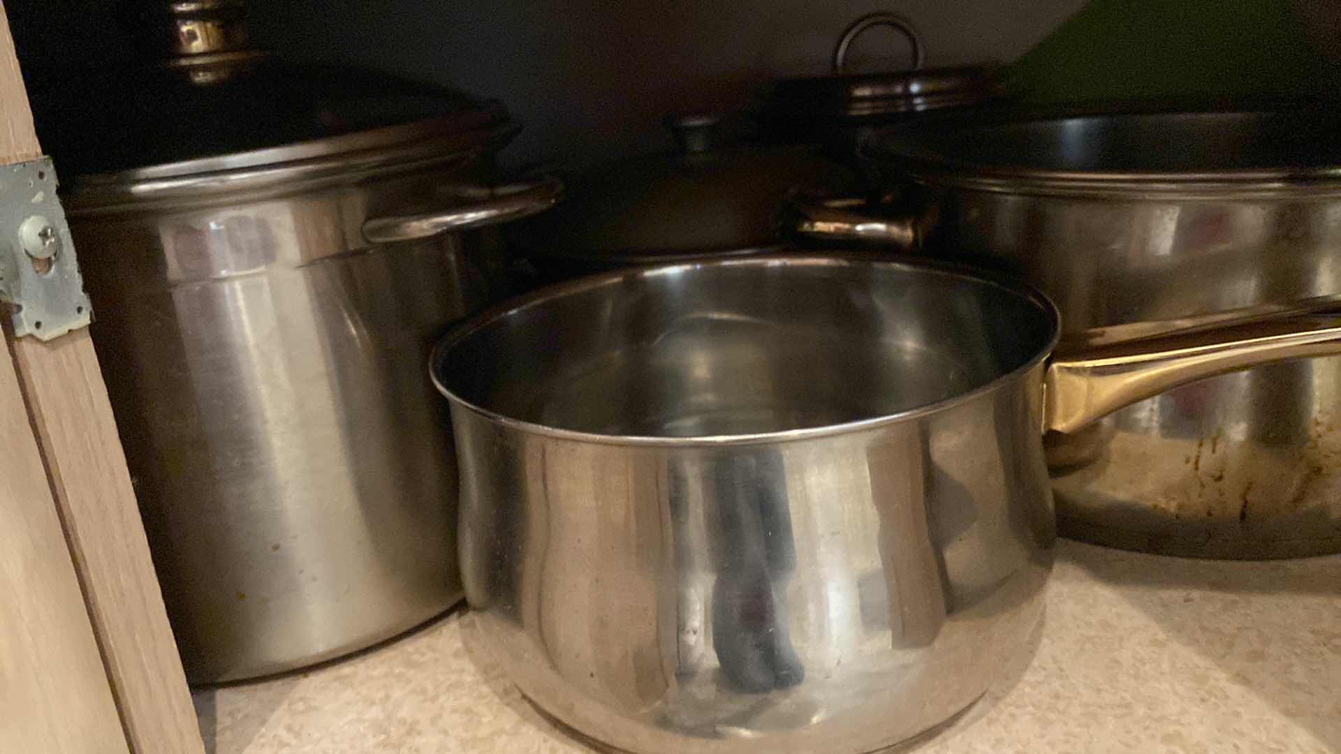 Photo 3 of CONTENTS OF KITCHEN CABINET POTS AND PANS