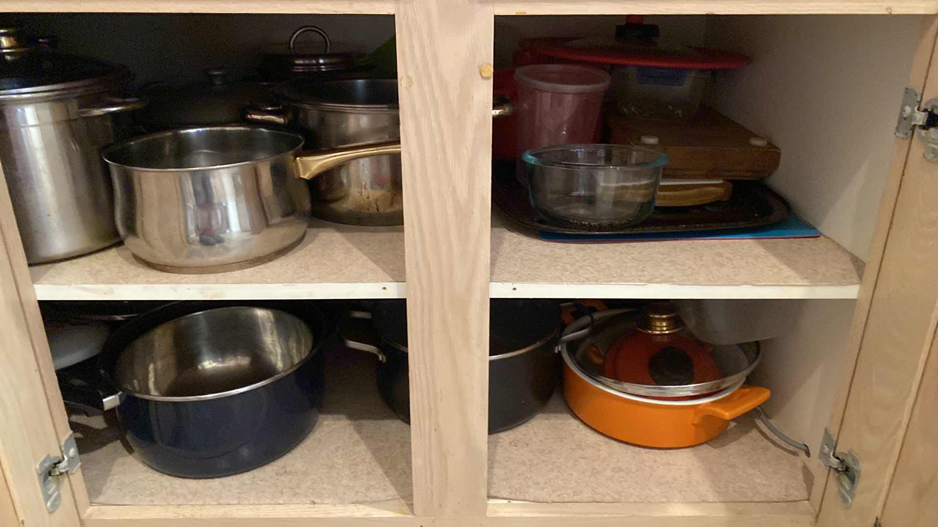 Photo 1 of CONTENTS OF KITCHEN CABINET POTS AND PANS