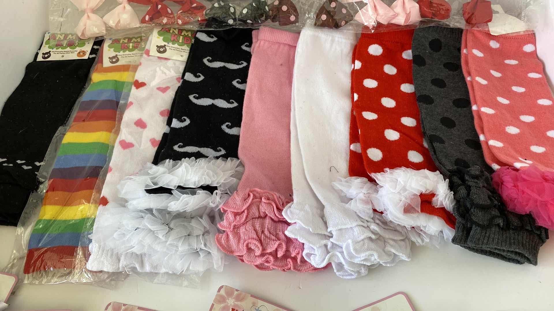 Photo 2 of GIRLS ACCESSORIES LEG WARMERS AND BARRETTES