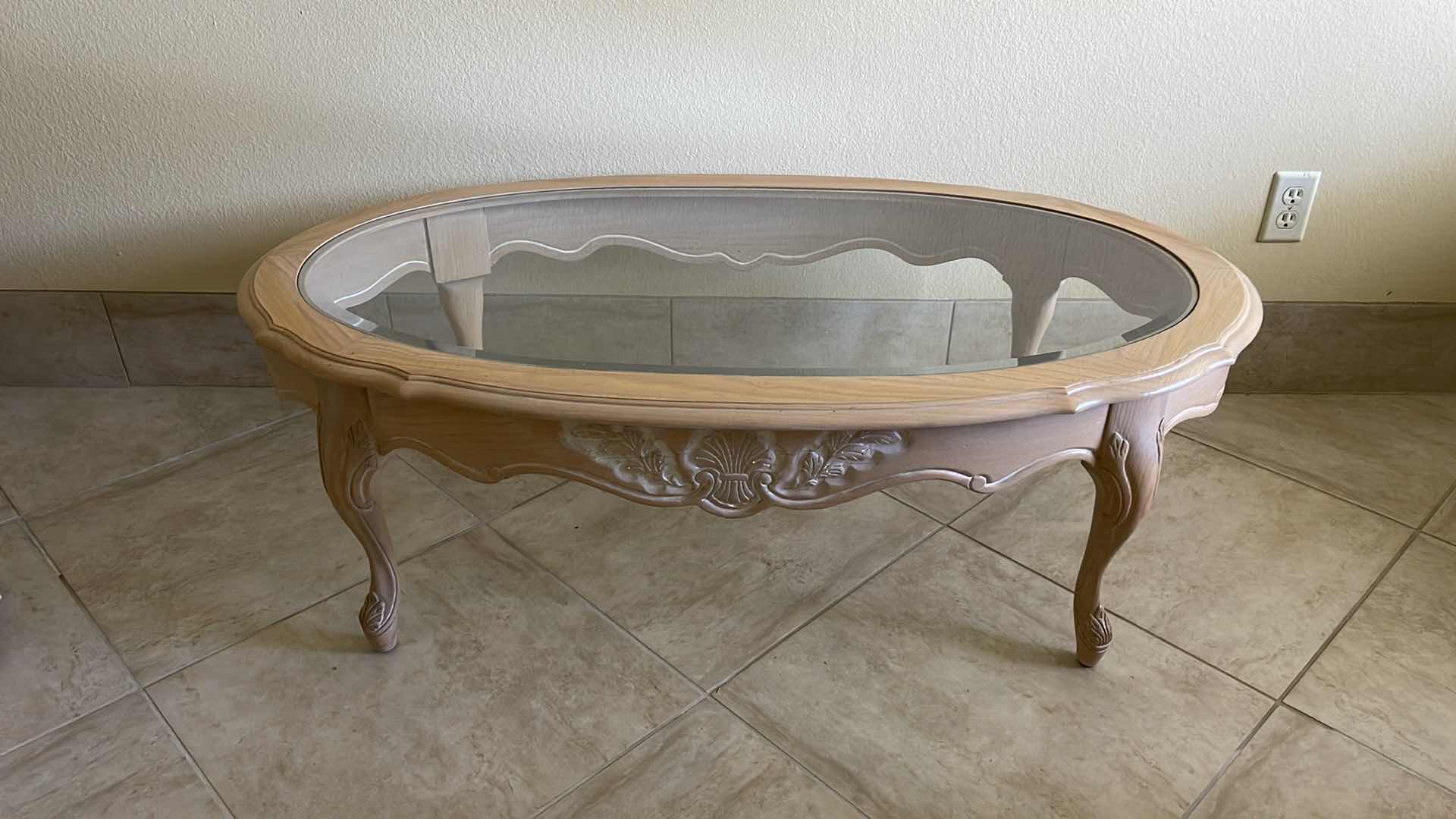 Photo 1 of WOOD AND GLASS OVAL COFFEE TABLE 48” X 28” H 16”