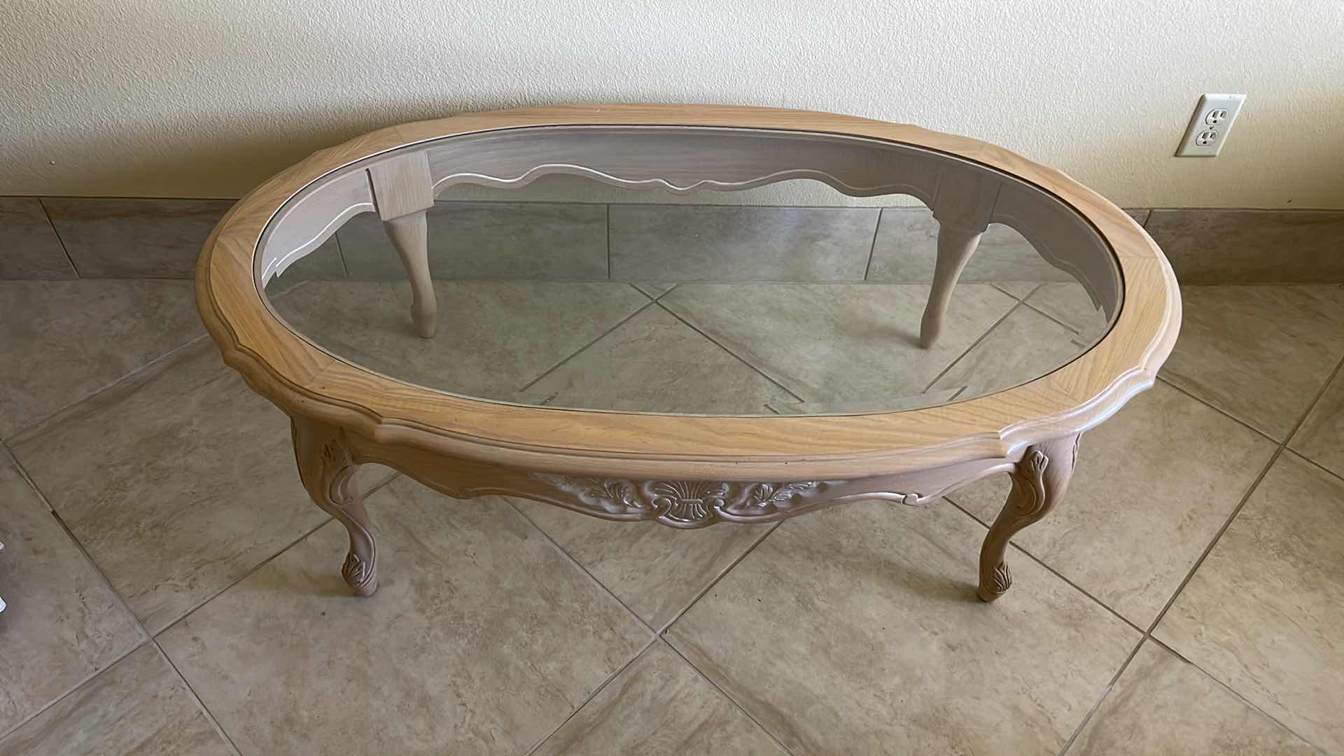 Photo 2 of WOOD AND GLASS OVAL COFFEE TABLE 48” X 28” H 16”