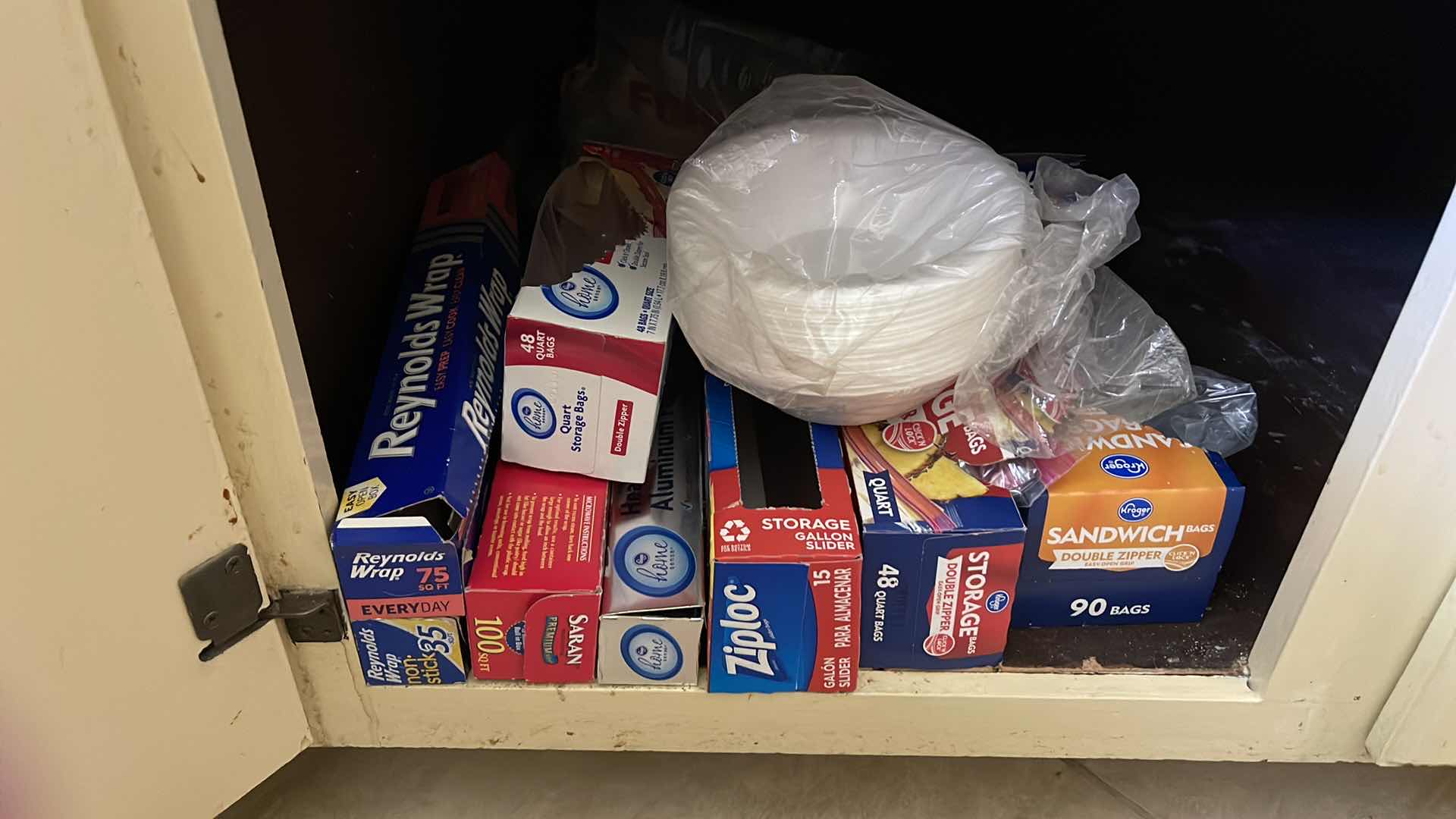 Photo 3 of CONTENTS OF CUPBOARD, DISHTOWELS, PLASTIC STORAGE BAGS