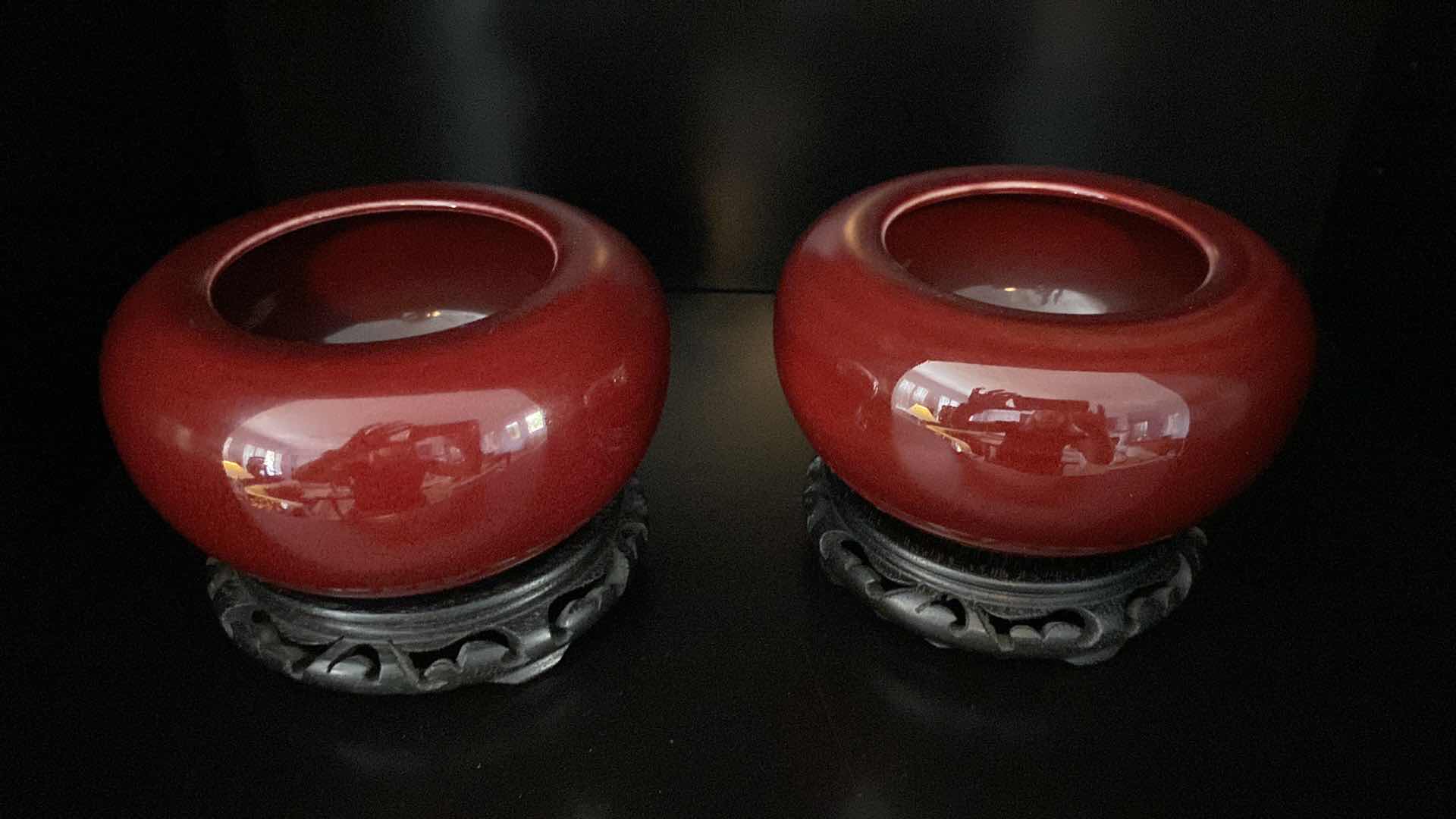 Photo 2 of VINTAGE PAIR OF CHINESE  CRANBERRY RED POTTERY BOWLS ON STANDS 6” x 4”