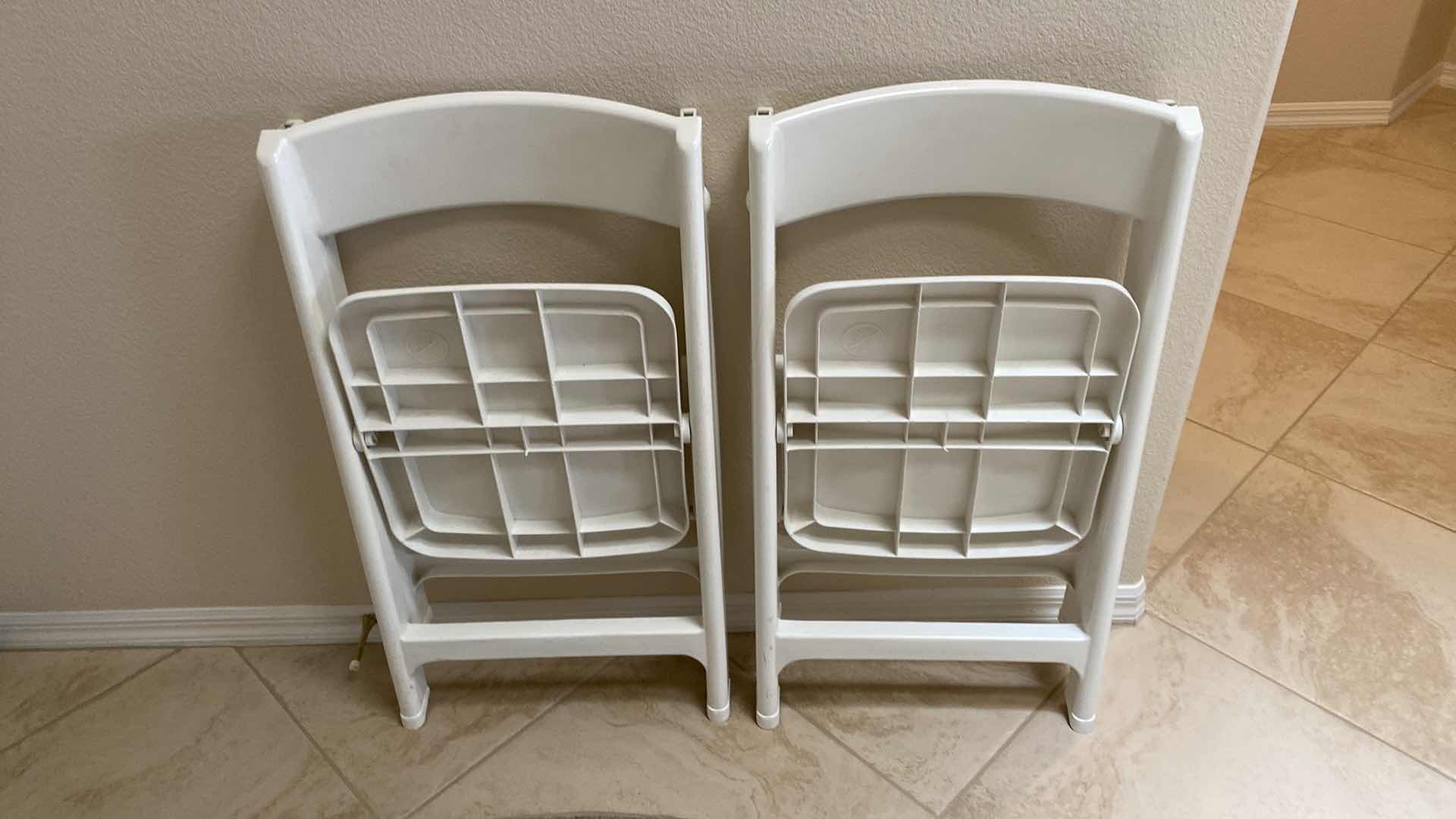 Photo 4 of PAIR OF PLASTIC FOLDING CHAIRS