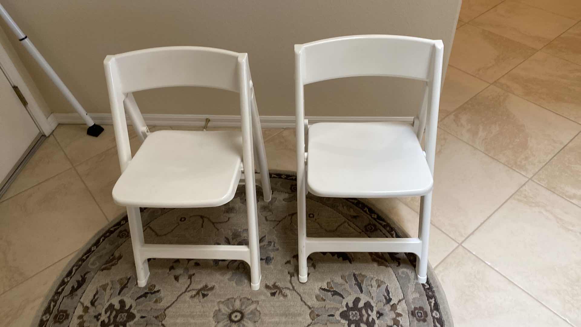 Photo 1 of PAIR OF PLASTIC FOLDING CHAIRS