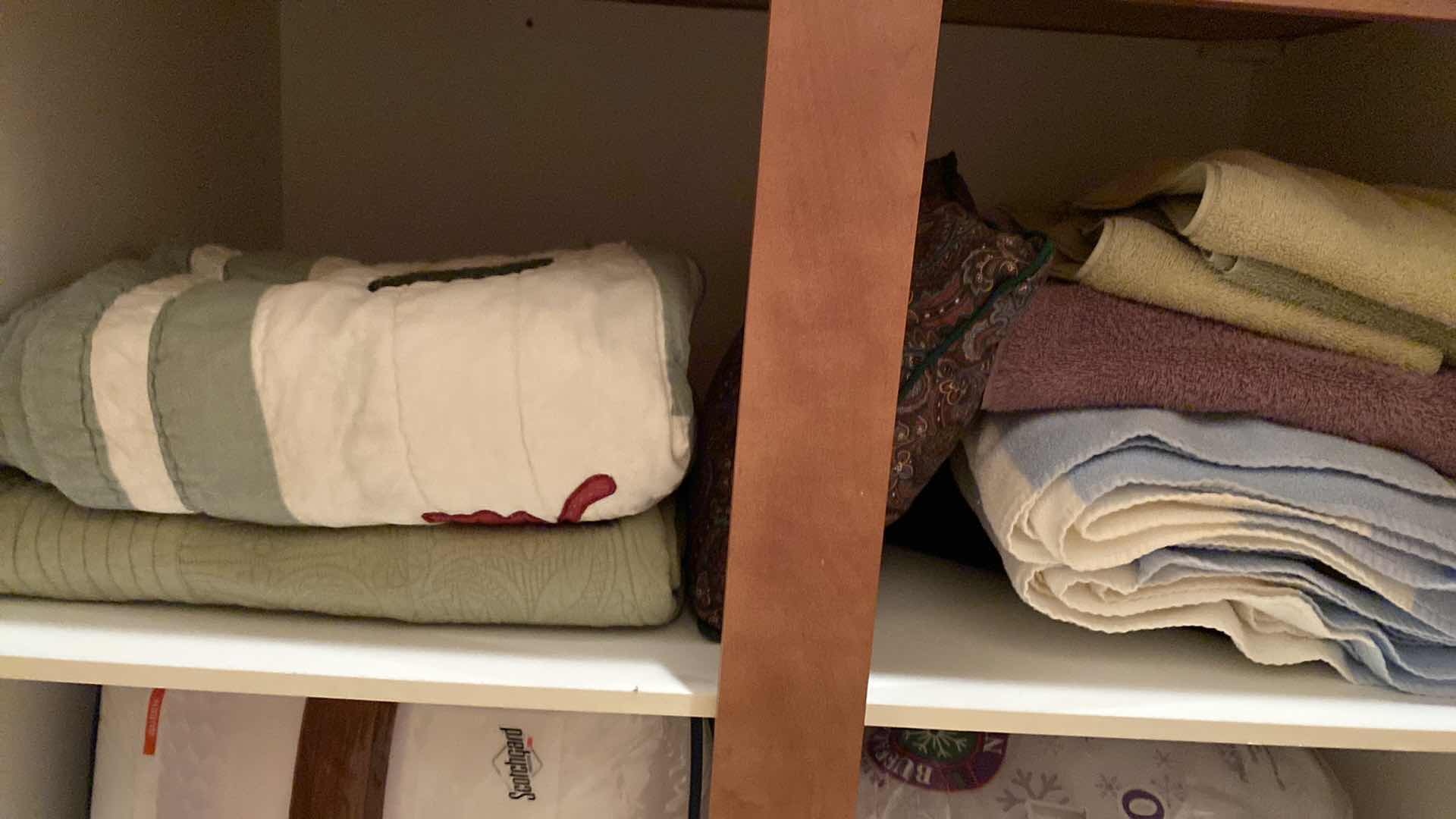 Photo 2 of Contents of 2 cabinets, quilts towels, linens