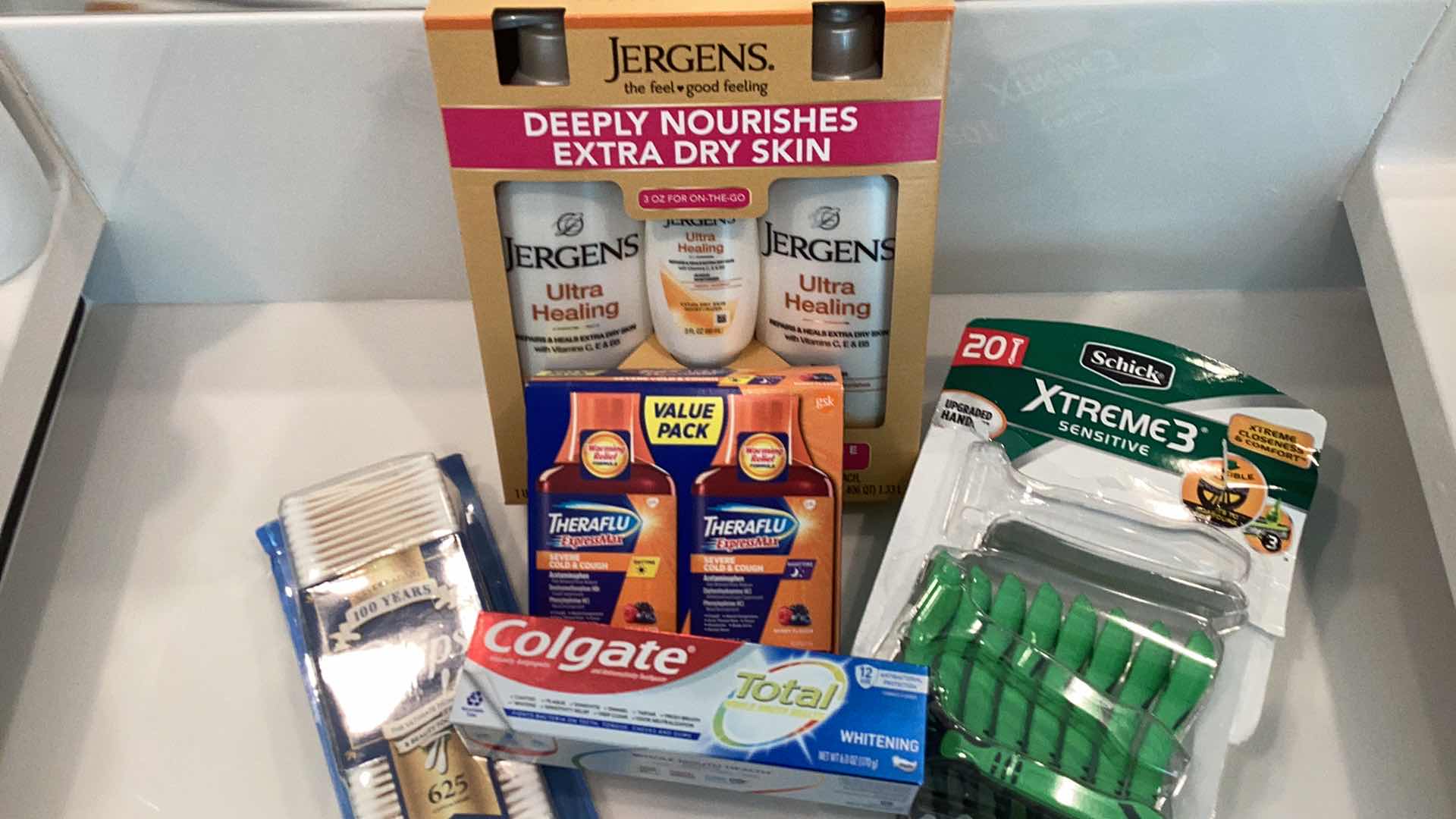 Photo 1 of JERGENS ULTRA HEALING LOTION SET-SCHICK XTREME3 RAZORS-THERAFLU AND MORE