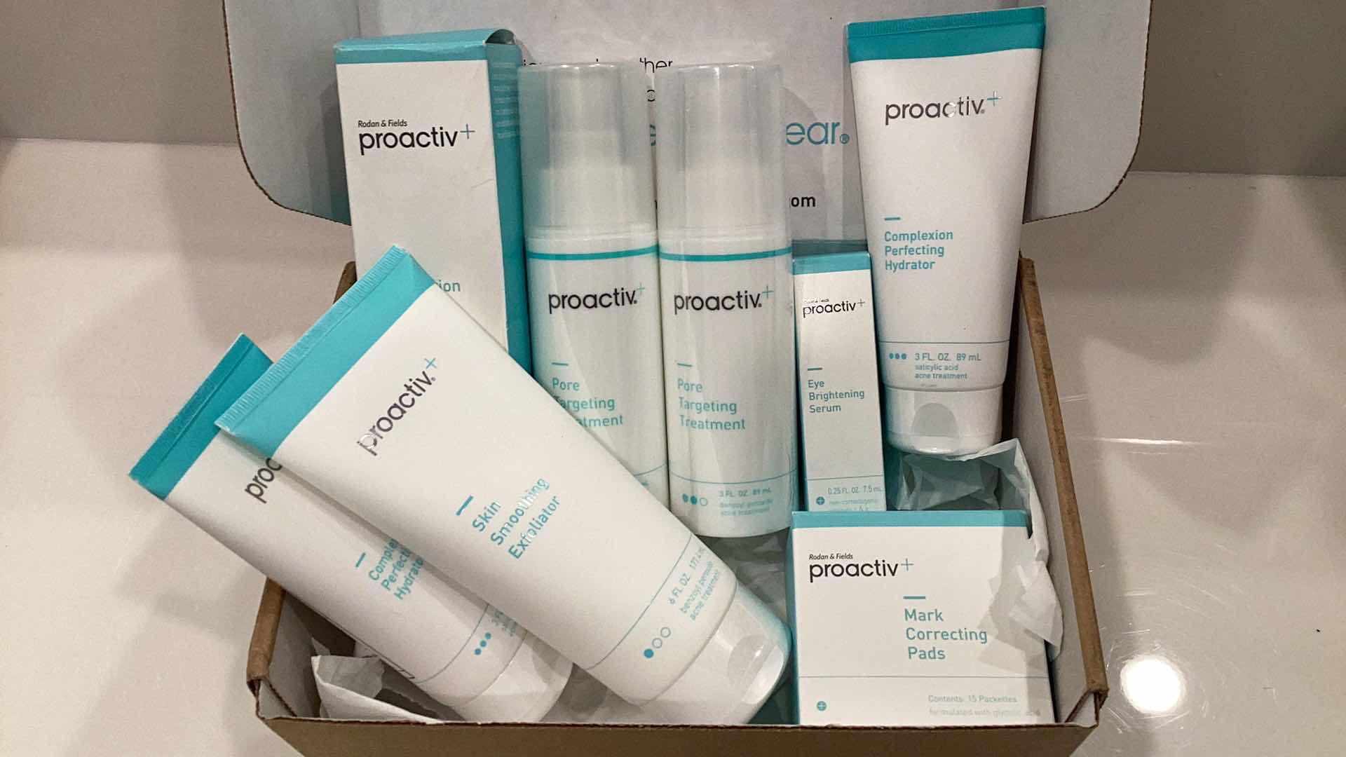 Photo 2 of PROACTIVE THIS PRODUCT IS EXPIRED BUT ITS SEALED FROM FACTORY IT INCLUDES COMPLEXION PERFECTING HYDRATOR, SKIN SMOOTHING EXFOLIATOR, MARK CORRECTING PADS, EYE BRIGHTENING SERUM, AND OTHER SKIN ESSENTIALS FOR EVERYDAY ROUTINE.