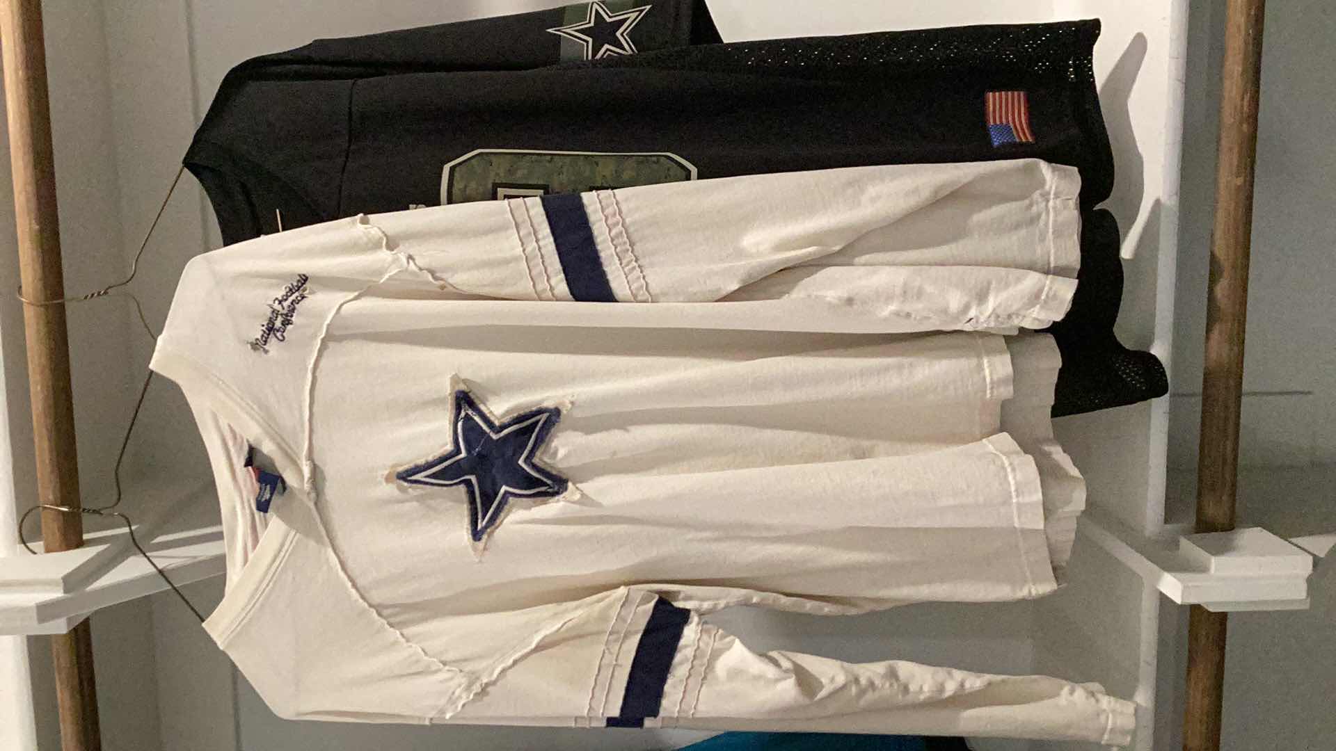 Photo 3 of DALLAS COWBOYS JERSEY WITH COOPER 19 AND A DALLAS COWBOYS TEE SHIRT. SIZES ARE M AND LARGE.