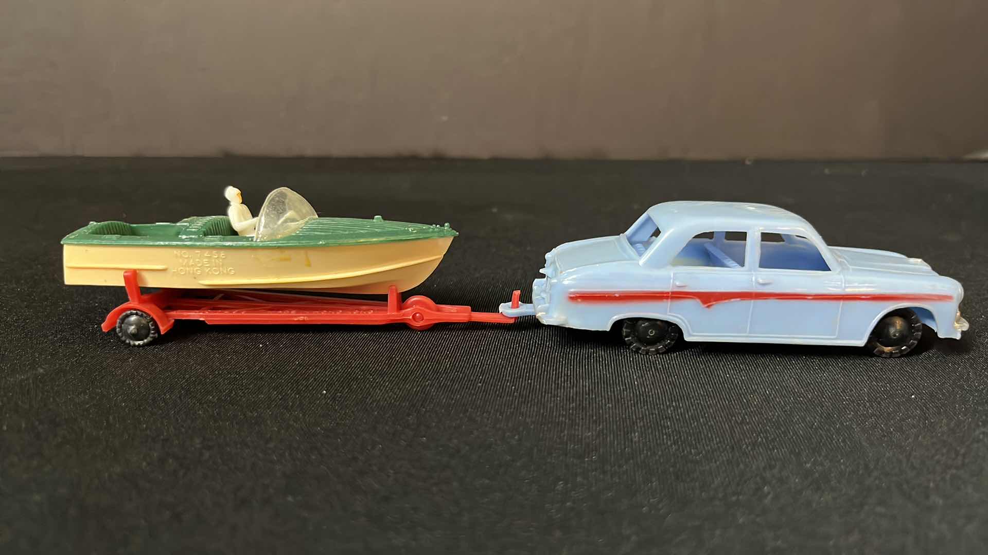 Photo 1 of A BLUE BOX PLASTIC TOY SERIES CAR AND BOAT TRAILER SET, FOR THE VACATIONER