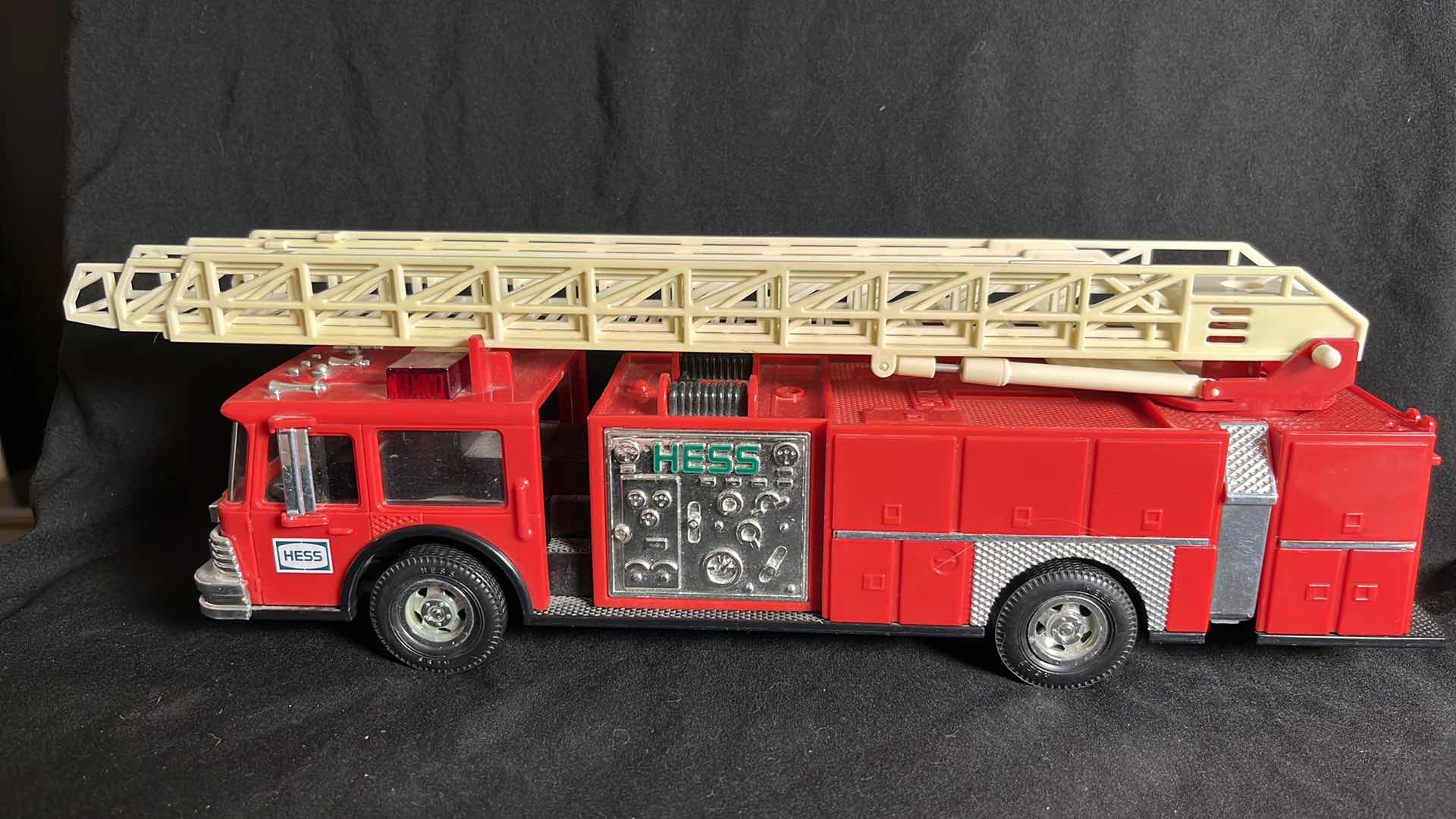 Photo 1 of HESS RED FIRE TRUCK BANK W AERIAL LADDER & ENGINE, BATTERY OPERATED, 1986, NO BOX