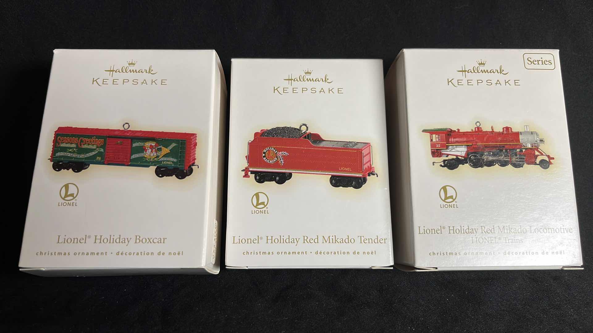 Photo 1 of HALLMARK LIONEL TRAIN HANDCRAFTED & METAL KEEPSAKE ORNAMENTS HOLIDAY BOXCAR 2009 (QXI1095), HOLIDAY RED MIKADO TENDER 2009 (QXI1102) & HOLIDAY RED MIKADO LOCOMOTIVE 2009 (#QX8602)