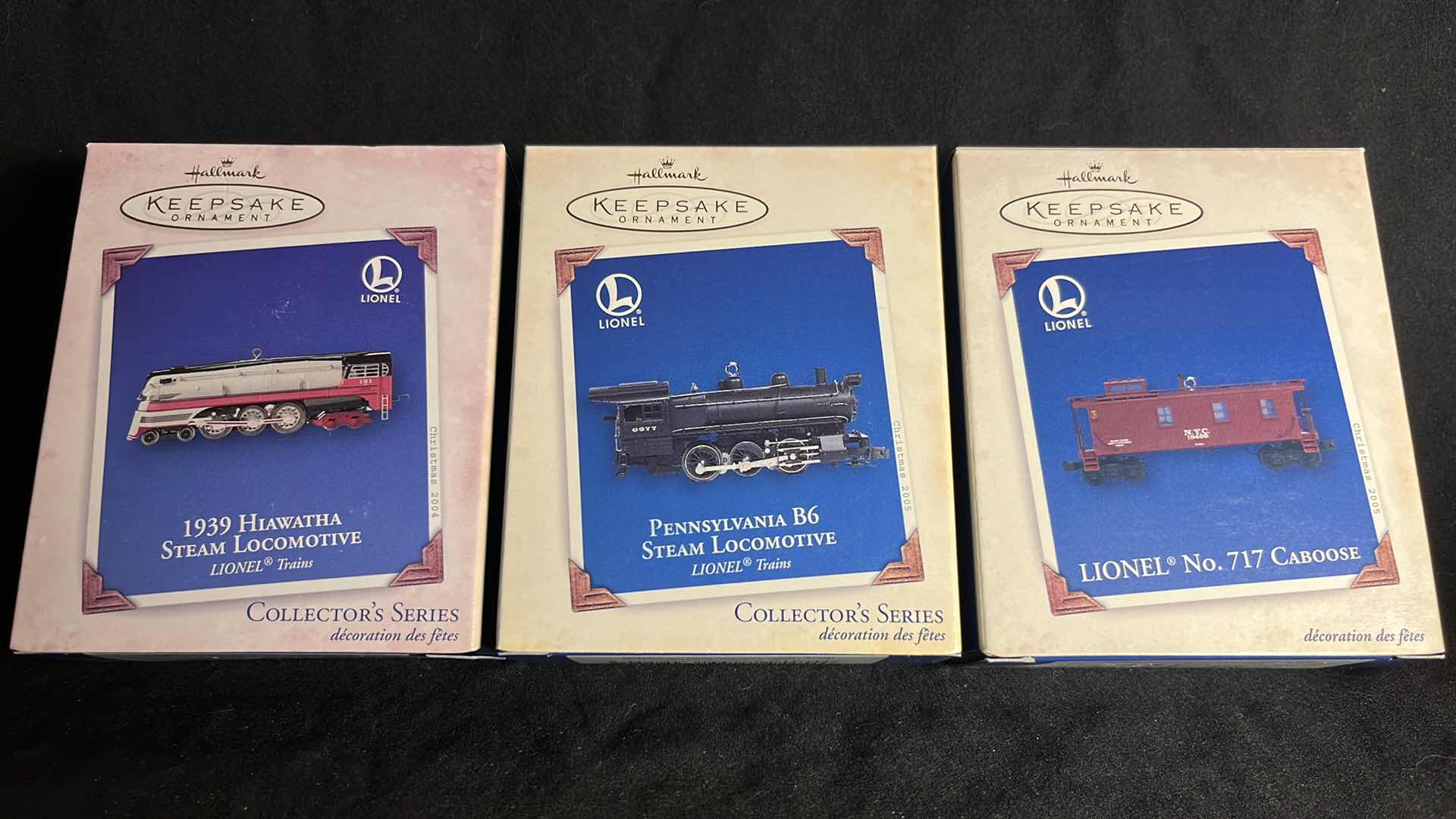 Photo 1 of HALLMARK LIONEL TRAIN DIE-CAST METAL KEEPSAKE ORNAMENTS 1939 HIAWATHA STEAM LOCOMOTIVE 2004 (#QX8454), PENNSYLVANIA B6 STEAM LOCOMOTIVE 2005 (#QX2052) & NO. 717 CABOOSE 2005 (#QX2122)