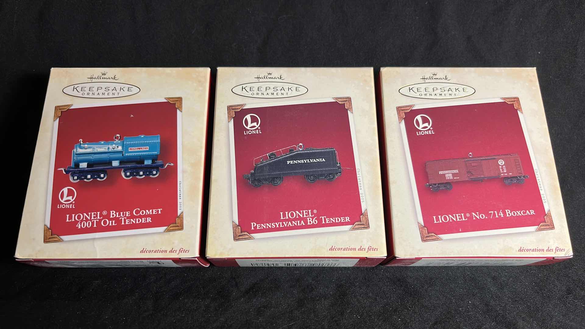 Photo 1 of HALLMARK LIONEL TRAIN DIE-CAST METAL & HANDCRAFTED KEEPSAKE ORNAMENTS BLUE COMET 400T OIL TENDER 2002 (#QX8243), PENNSYLVANIA B6 TENDER 2005 (#QXI6122) & NO. 714 BOXCAR 2005 (#QXI6125)