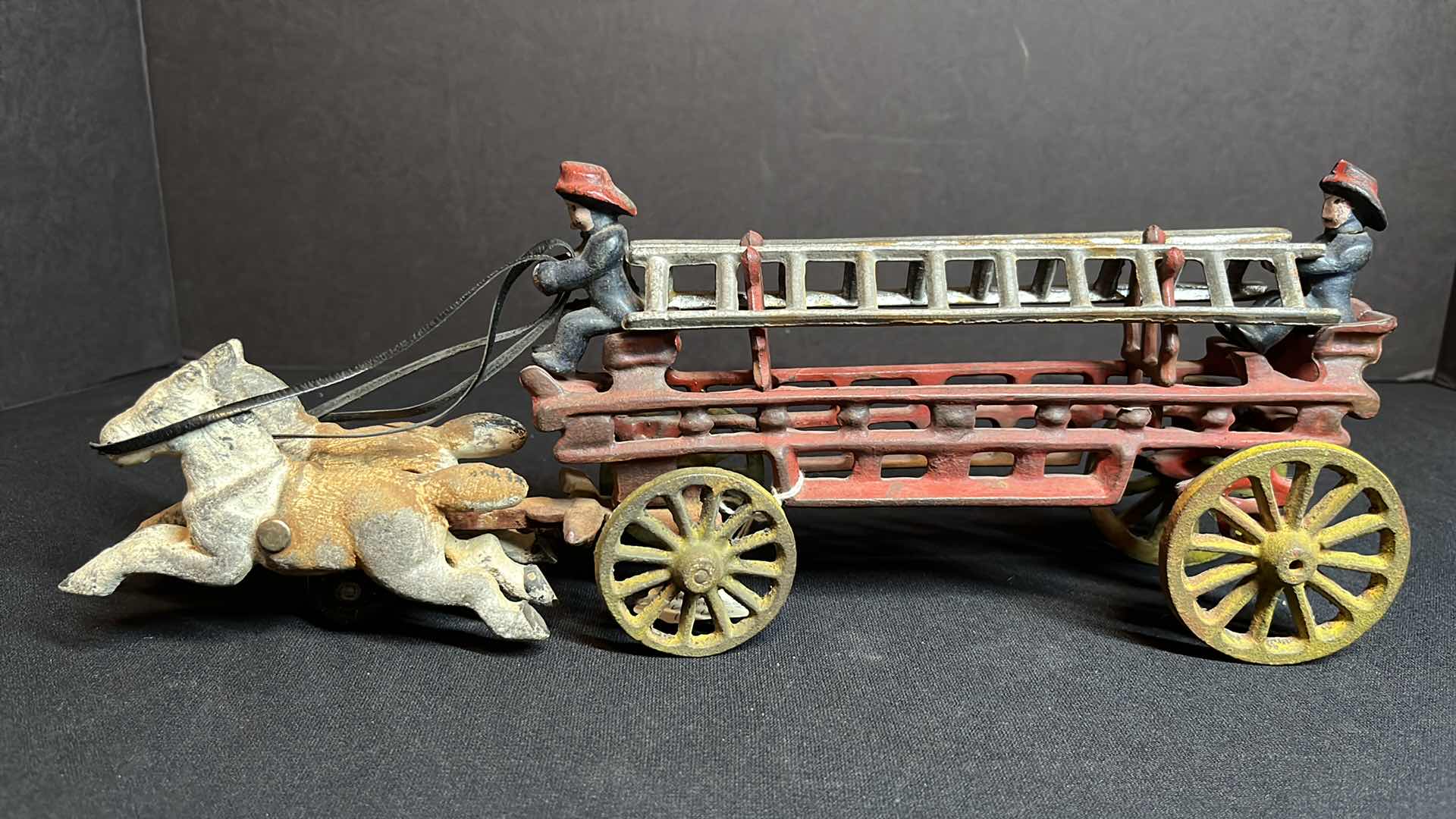 Photo 1 of ANTIQUE KENTON 14” CAST-IRON 2 HORSE FIRE WAGON HOOK & LADDER W 2 FIGURINES , 1915