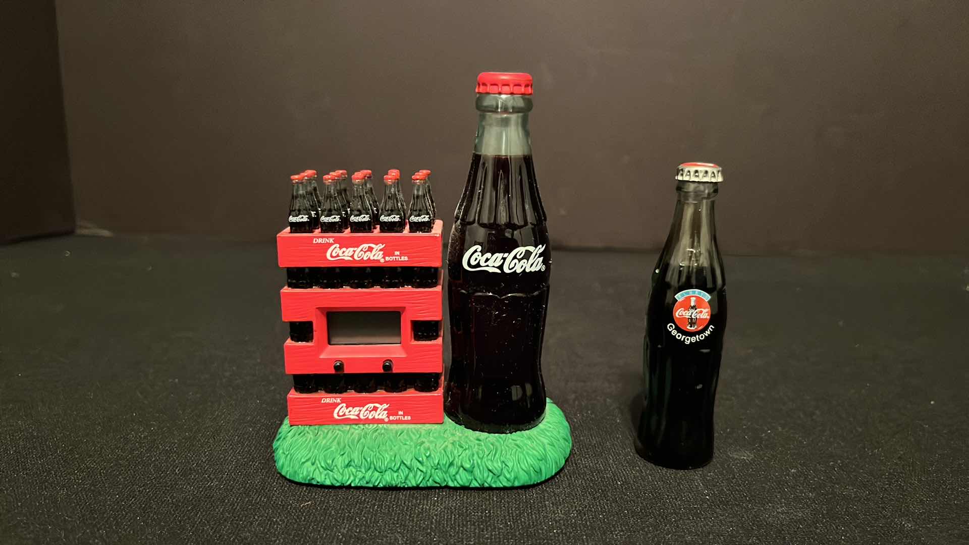 Photo 1 of COCA-COLA COLLECTIBLE MINI CLOCK ICE CHEST W COKE BOTTLE CASES 4”H, 2000 & COCA-COLA COLLECTIBLE GEORGETOWN MINI GLASS BOTTLE 3”H