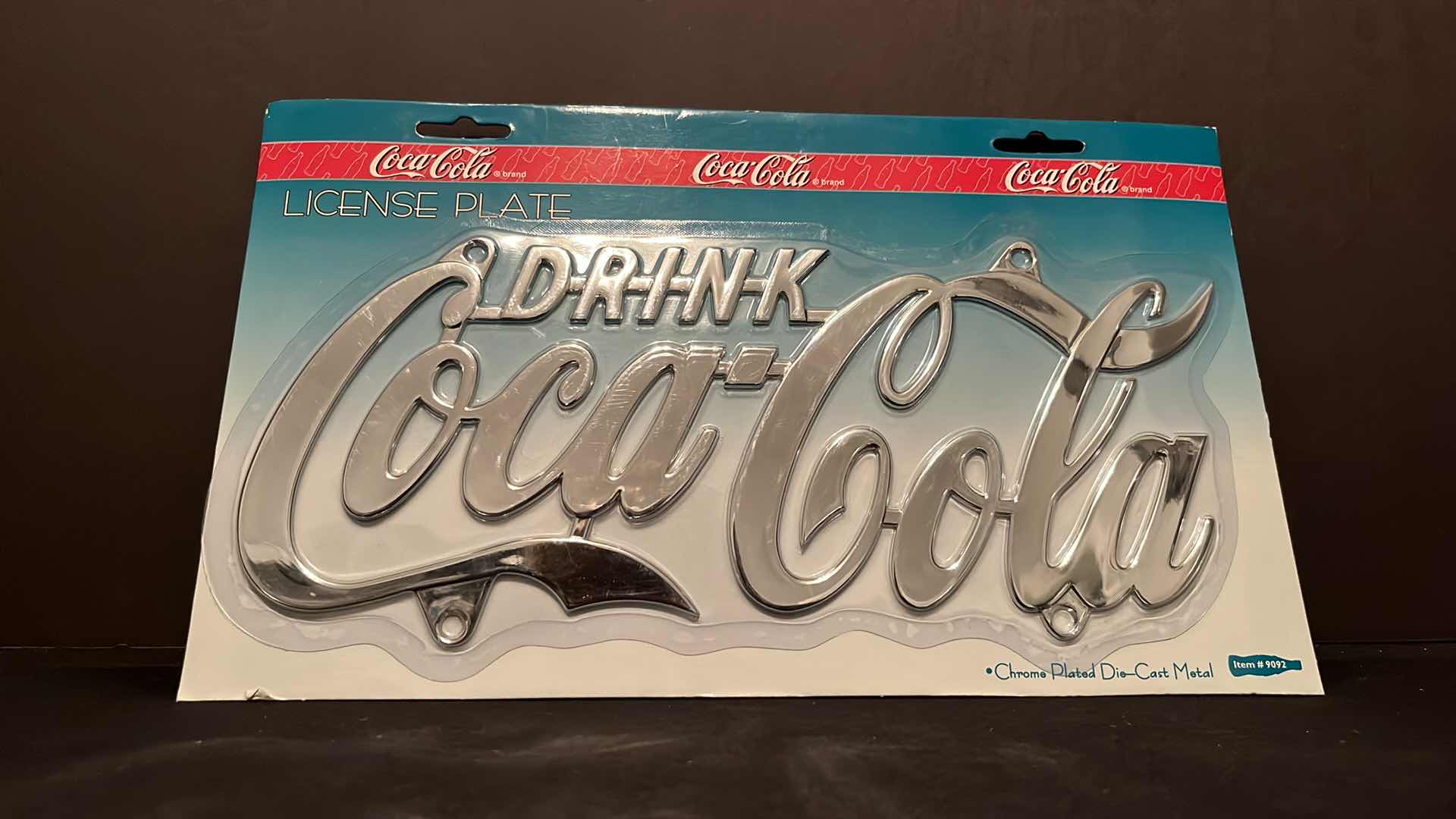 Photo 1 of NIP COCA-COLA BRAND CHROME PLATED DIE-CAST METAL “DRINK COCA-COLA” LICENSE PLATE 1998 (ITEM #9092)