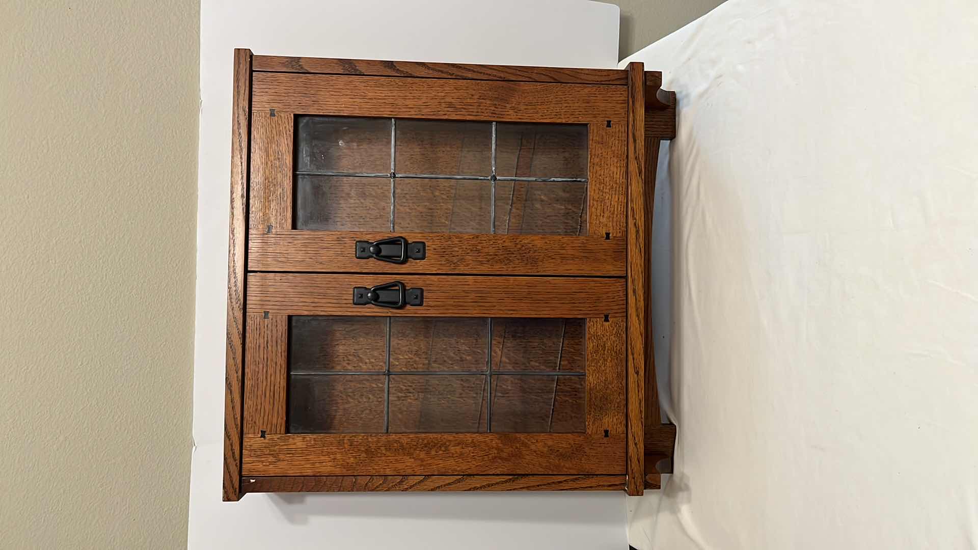 Photo 1 of MAHOGANY FINISH WOOD WALL CABINET W DISTORTED GLASS PANELS & GLASS SHELVES 5.5” X 23.5” H26”