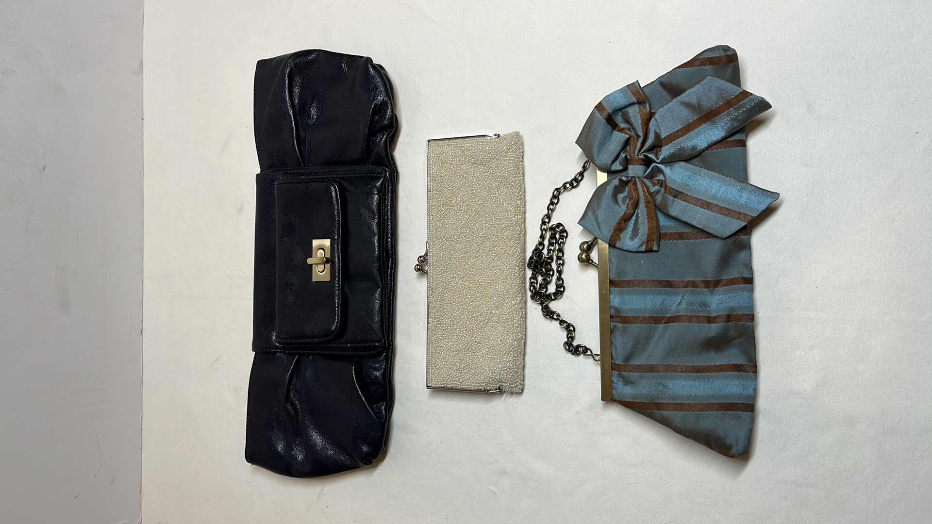 Photo 1 of CLUTCH STYLE PURSES (3)