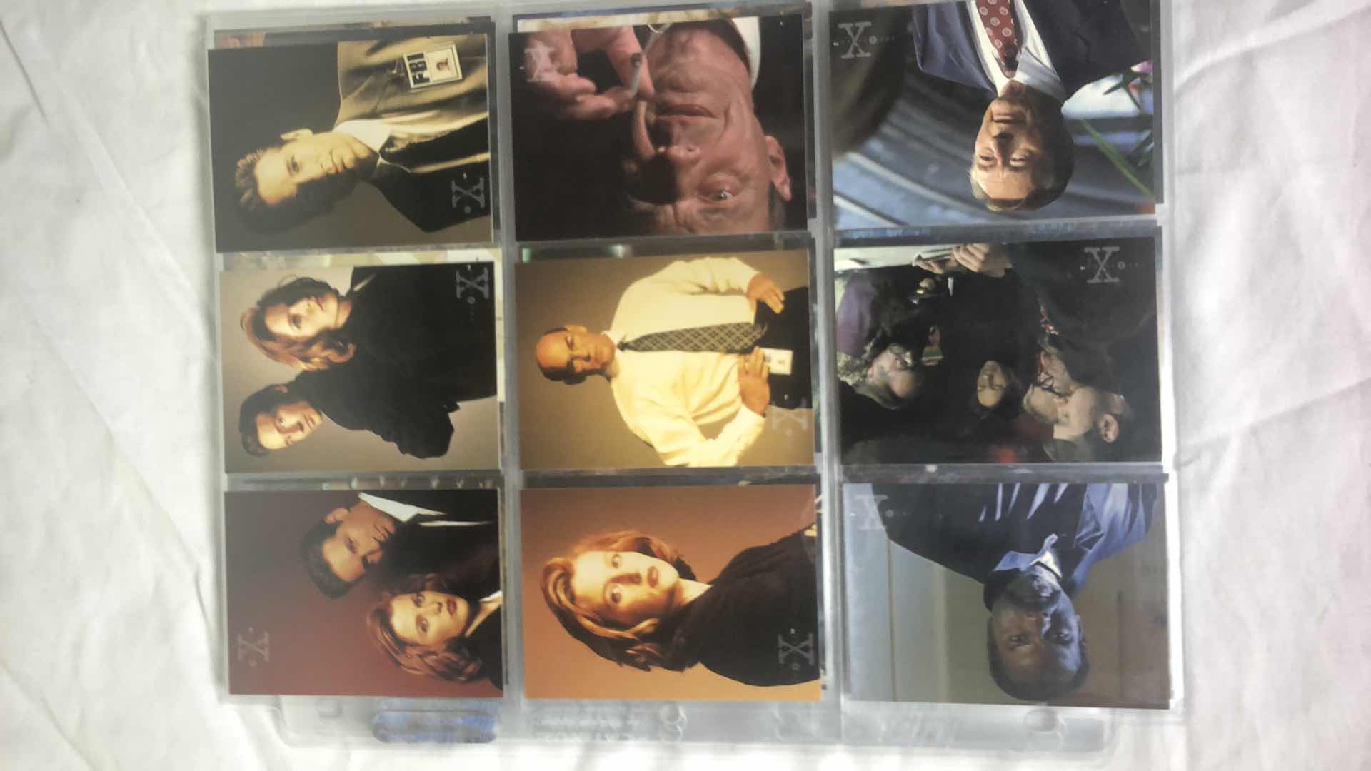 Photo 1 of APPROX 90 TOPPS THE X FILES TRADING CARDS NEAR COMPLETE SET IN SLEEVES NEAR PERFECT CONDITION