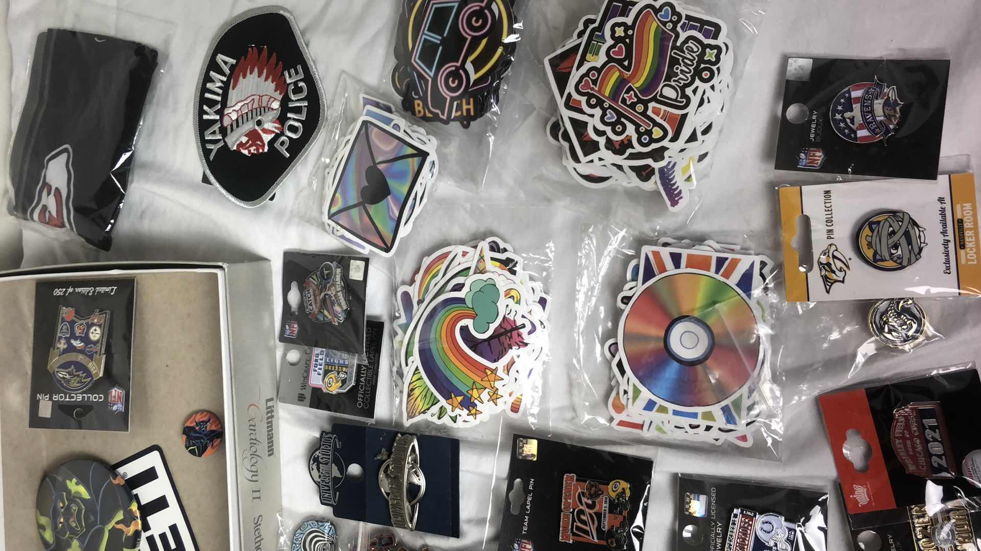 Photo 5 of BOX OF APPROX 200 STICKER DECALS AND 50 METAL PINS (GUN N ROSES, NFL FOOTBALL, MISC AND MORE