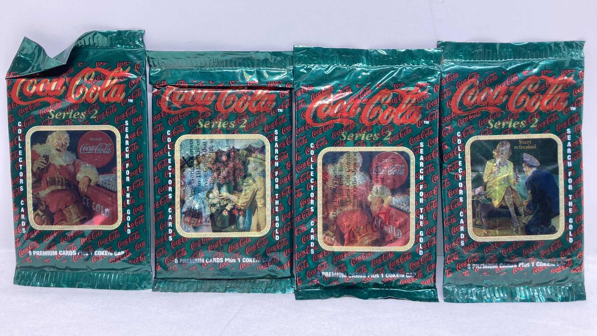 Photo 1 of COCA-COLA SERIES 2 SEARCH FOR GOLD PREMIUM COLLECTOR CARDS (4) SEALED