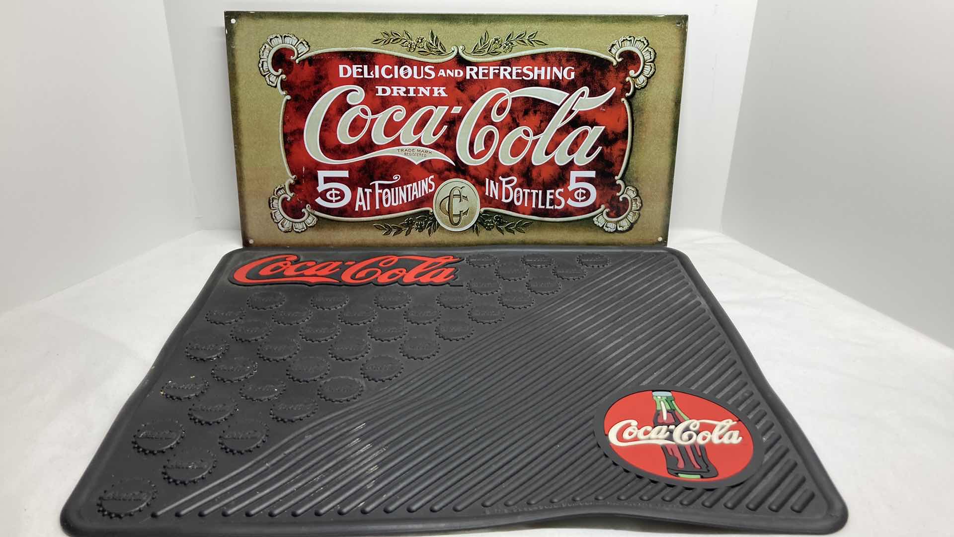 Photo 1 of COCA-COLA TIN SIGN & RUBBER MAT 16.5” X 14.5”