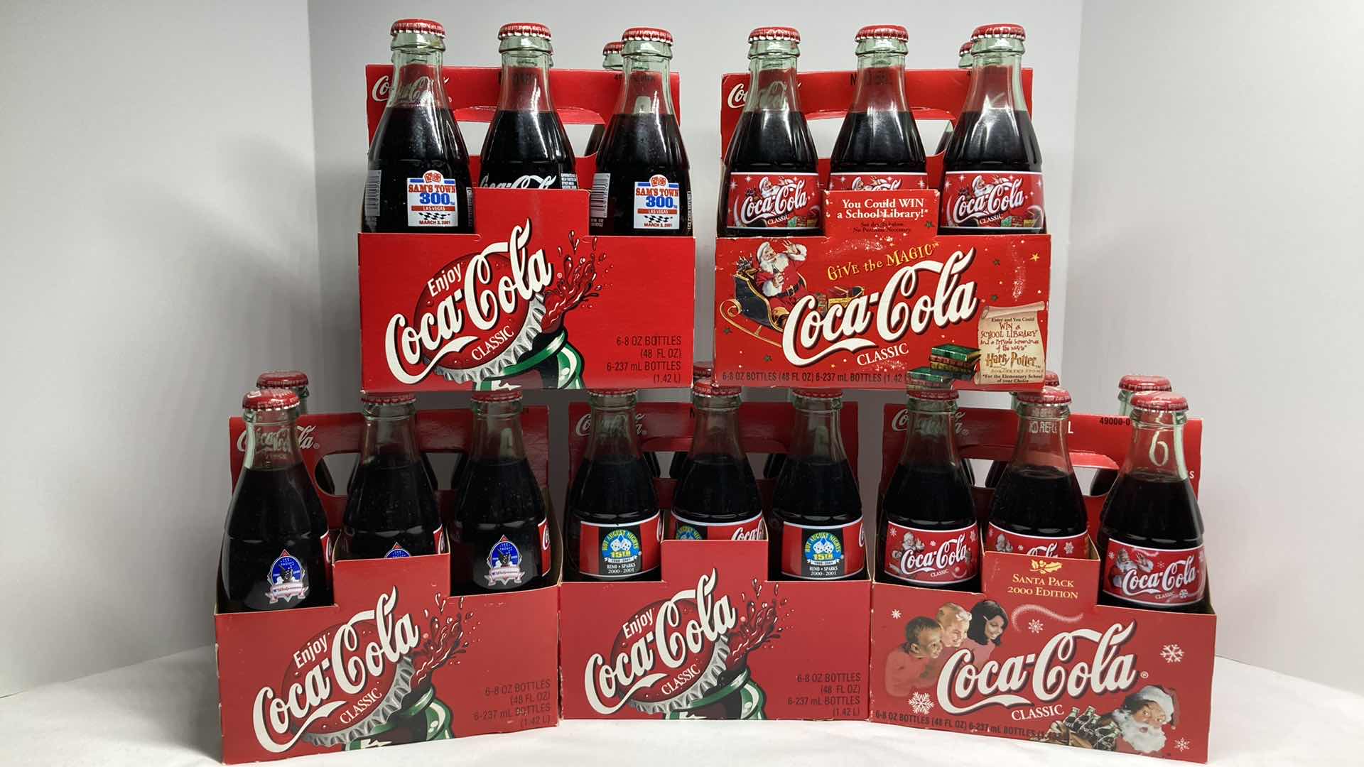 Photo 1 of COCA-COLA SPECIAL EDITION 6 PACK SEALED GLASS BOTTLES & CASES (5)