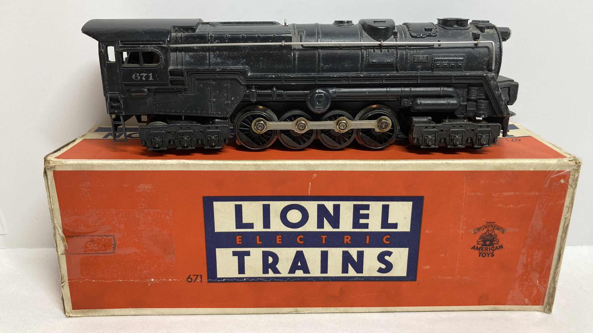 Photo 1 of LIONEL ELECTRIC TRAINS LOCOMOTIVE W SMOKE CHAMBER NO.671