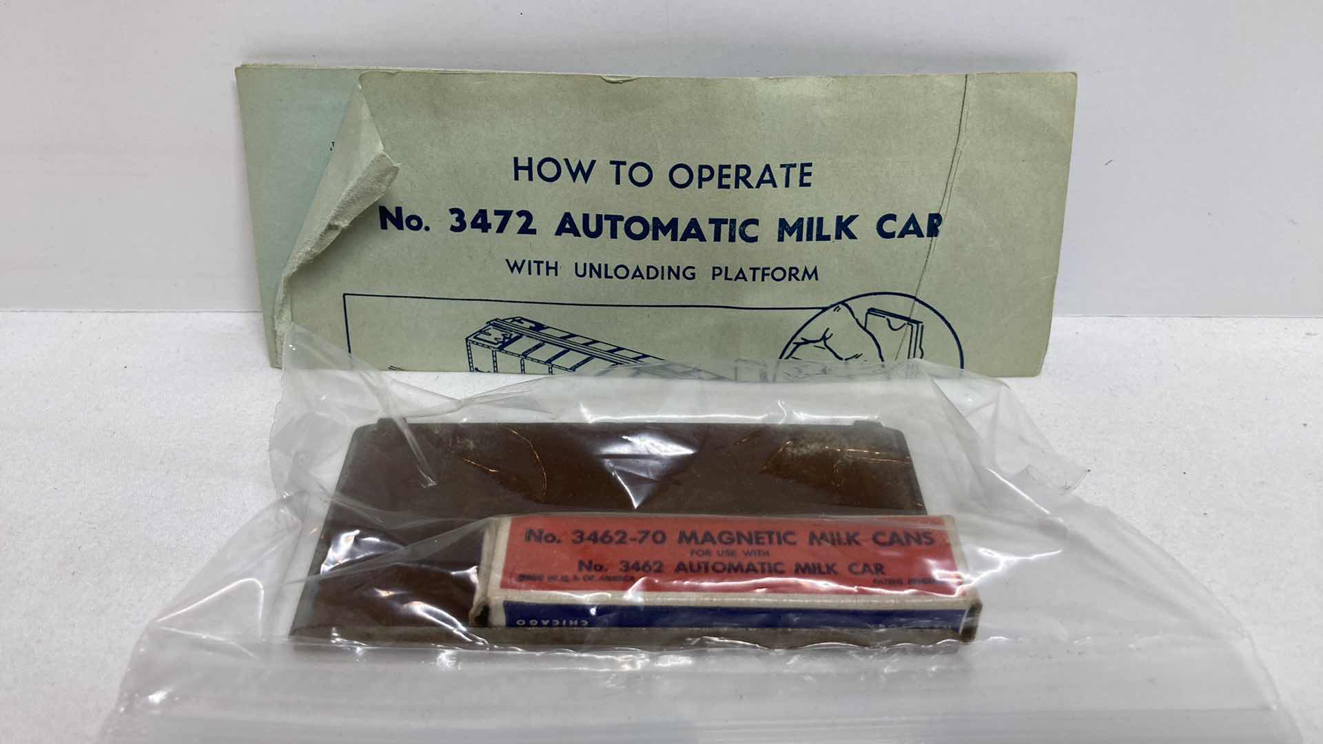 Photo 9 of LIONEL ELECTRIC TRAINS AUTOMATIC MILK CAR W UNLOADING PLATFORM NO.3472