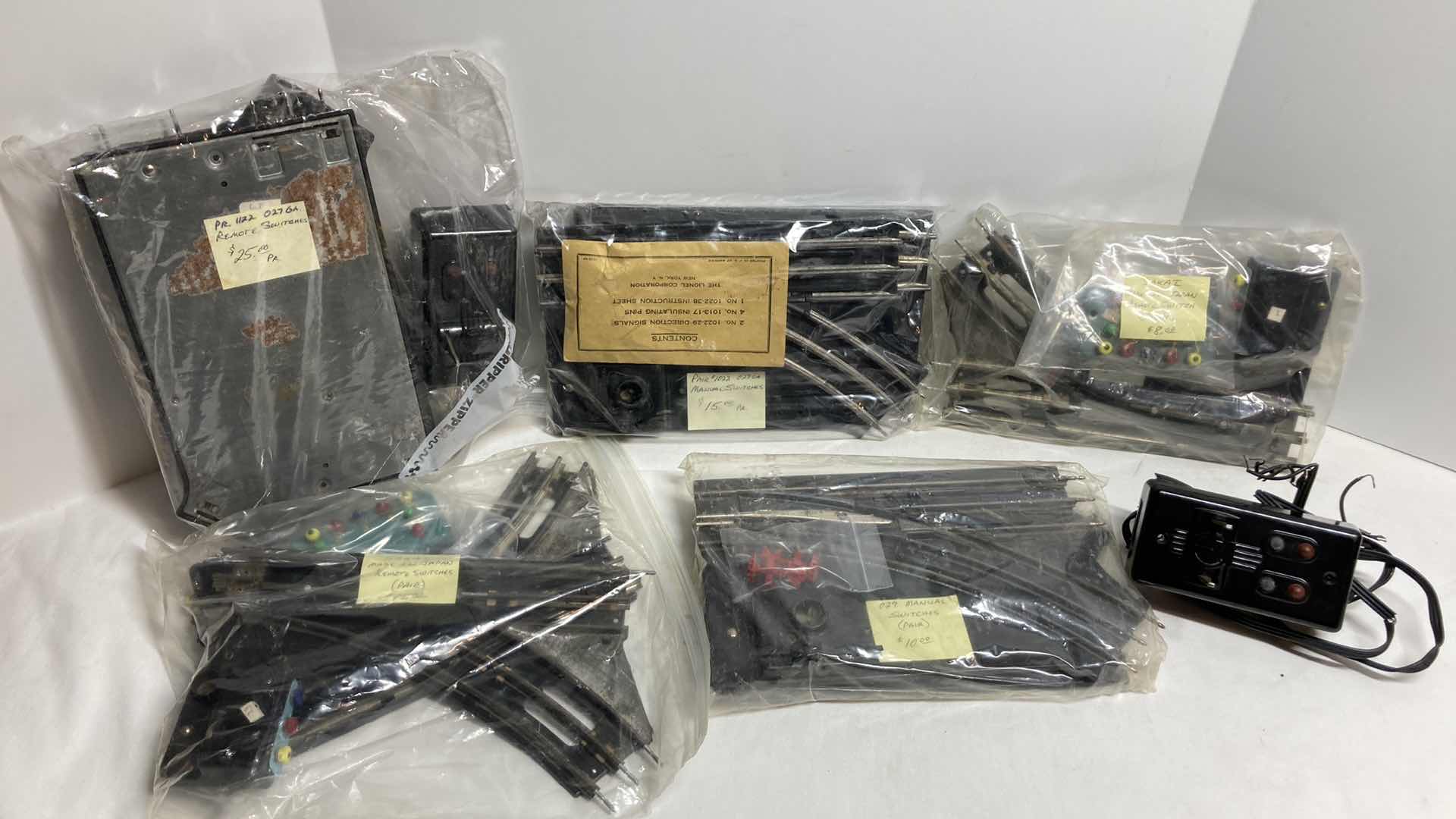 Photo 1 of LIONEL O27 GAUGE REMOTE W REMOTES, MANUAL SWITCHES (3) & SAKAI REMOTE SWITCHES JAPAN (2)