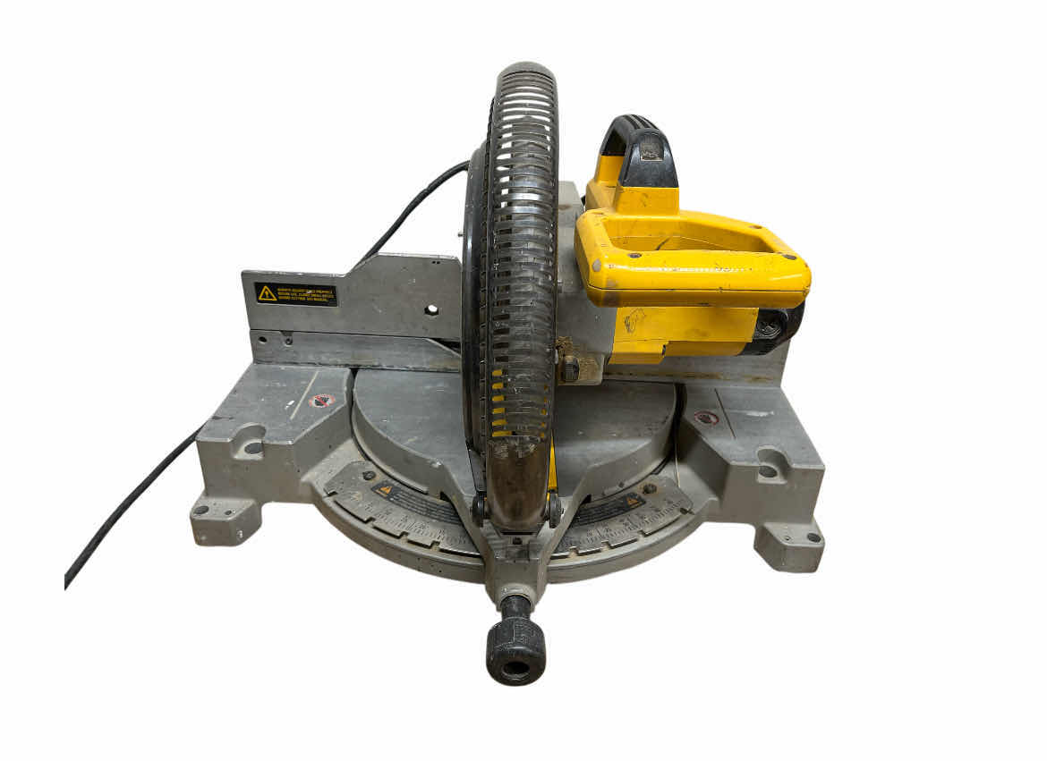 Photo 1 of DEWALT 12” COMPOUND MITTER SAW MODEL DW705