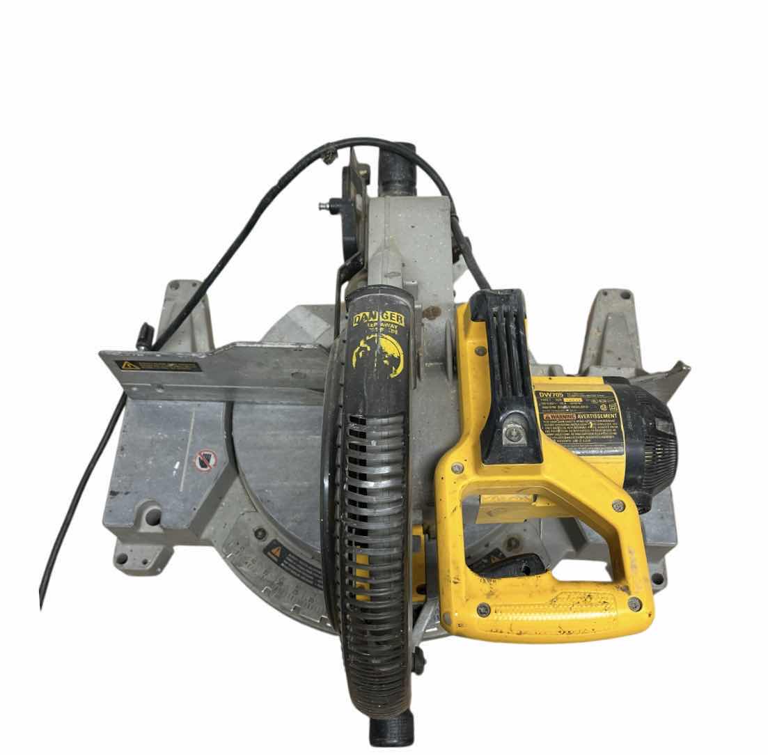 Photo 1 of DEWALT 12” COMPOUND MITTER SAW MODEL DW705