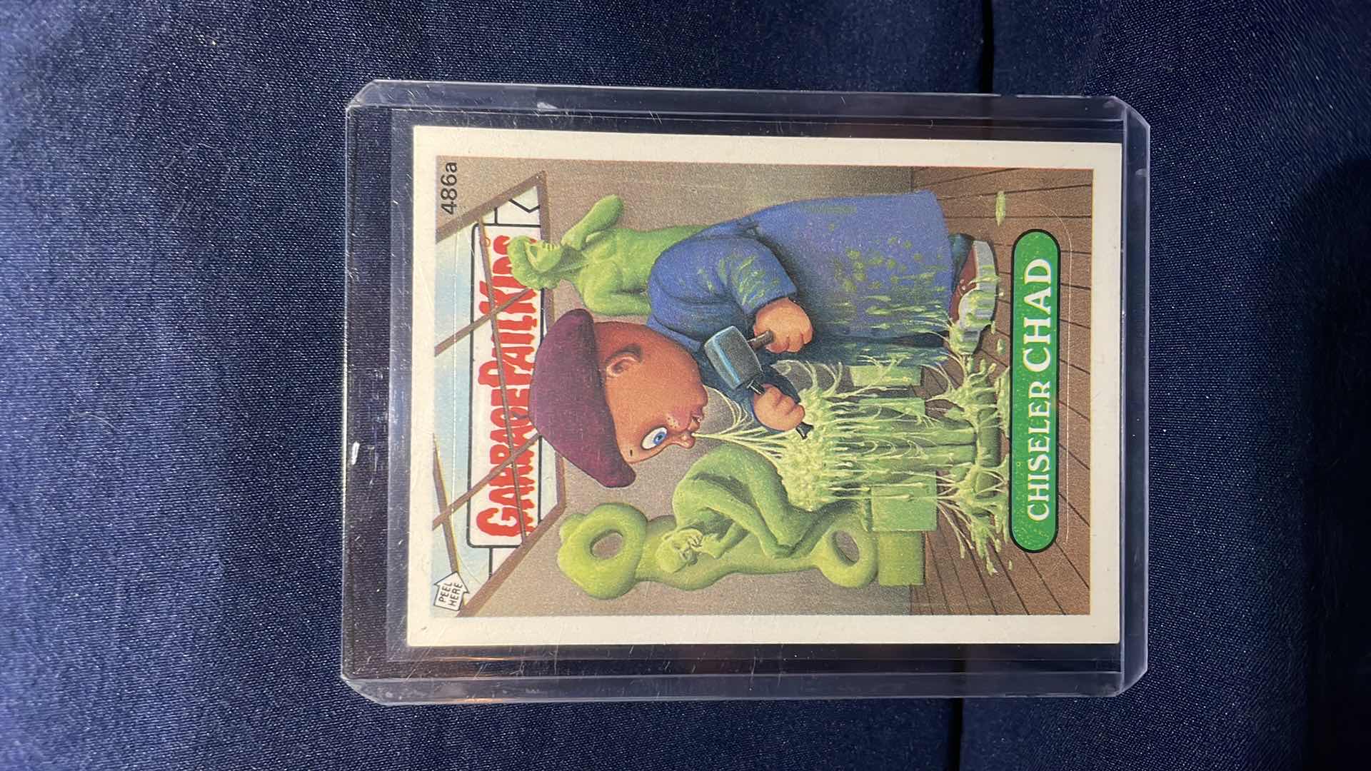 Photo 1 of 1988 TOPPS GARBAGE PAIL KIDS CHISELER CHAD CARD # 486a