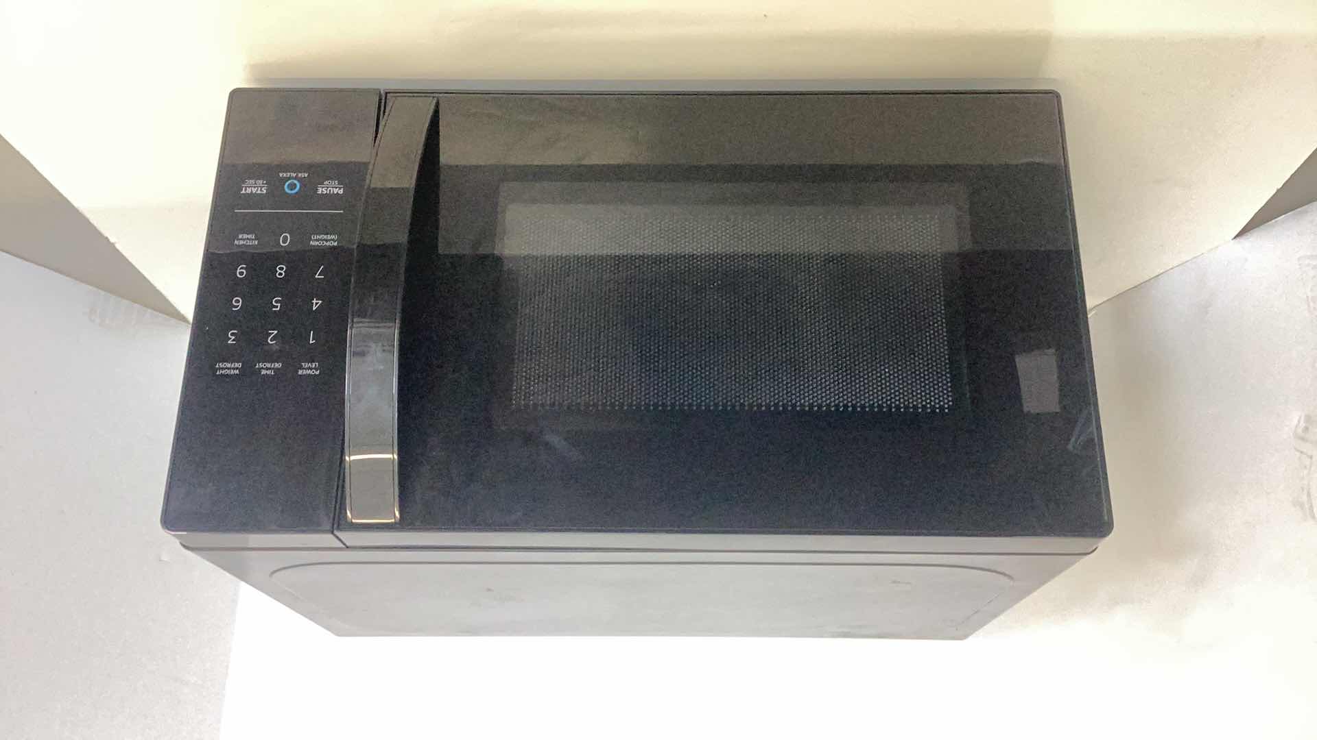 Photo 1 of AMAZON BASICS MICROWAVE WITH ALEXA 17” X 12” H 10”