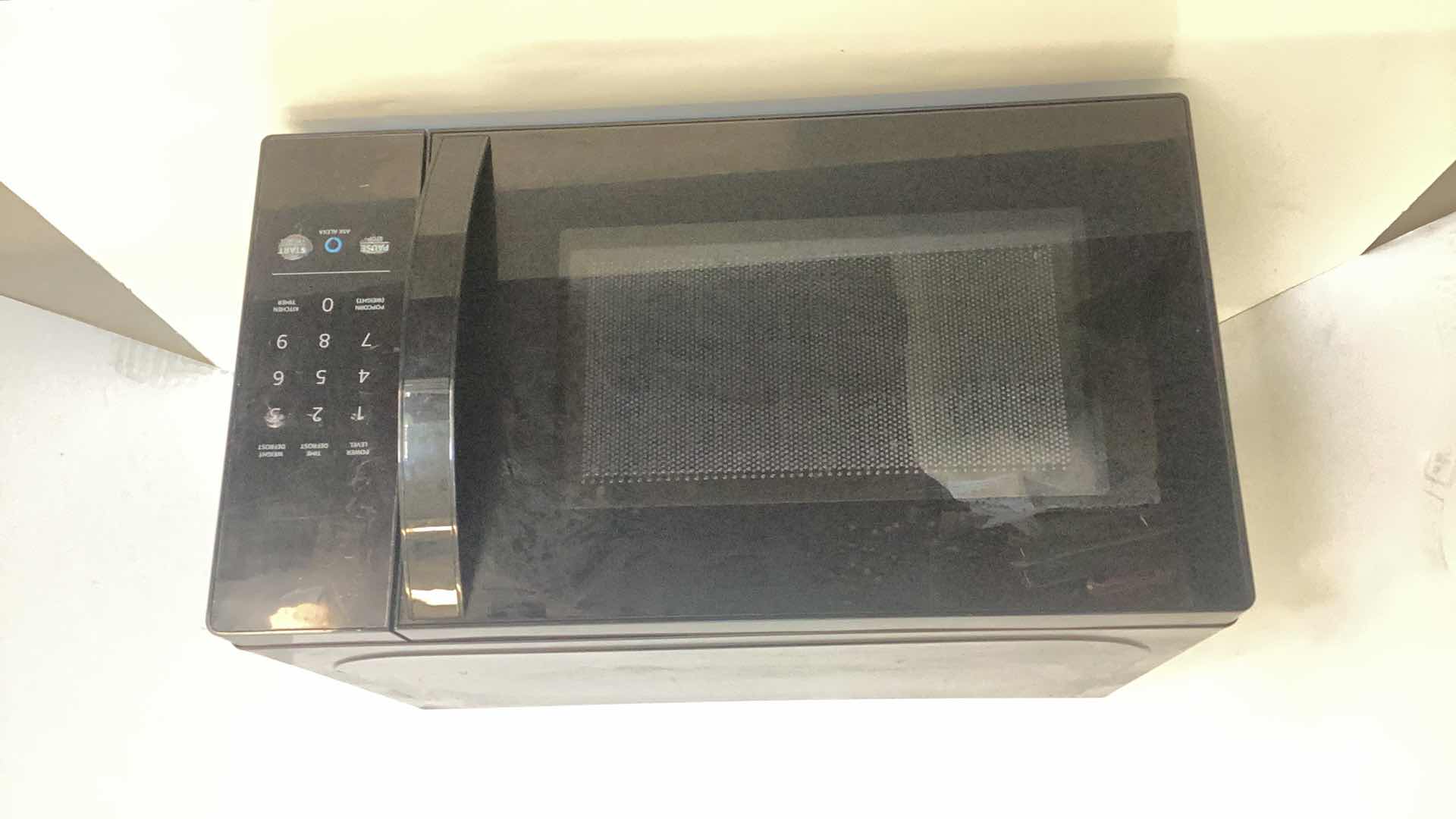 Photo 1 of AMAZON BASICS MICROWAVE WITH ALEXA 17” X 12” H 10”