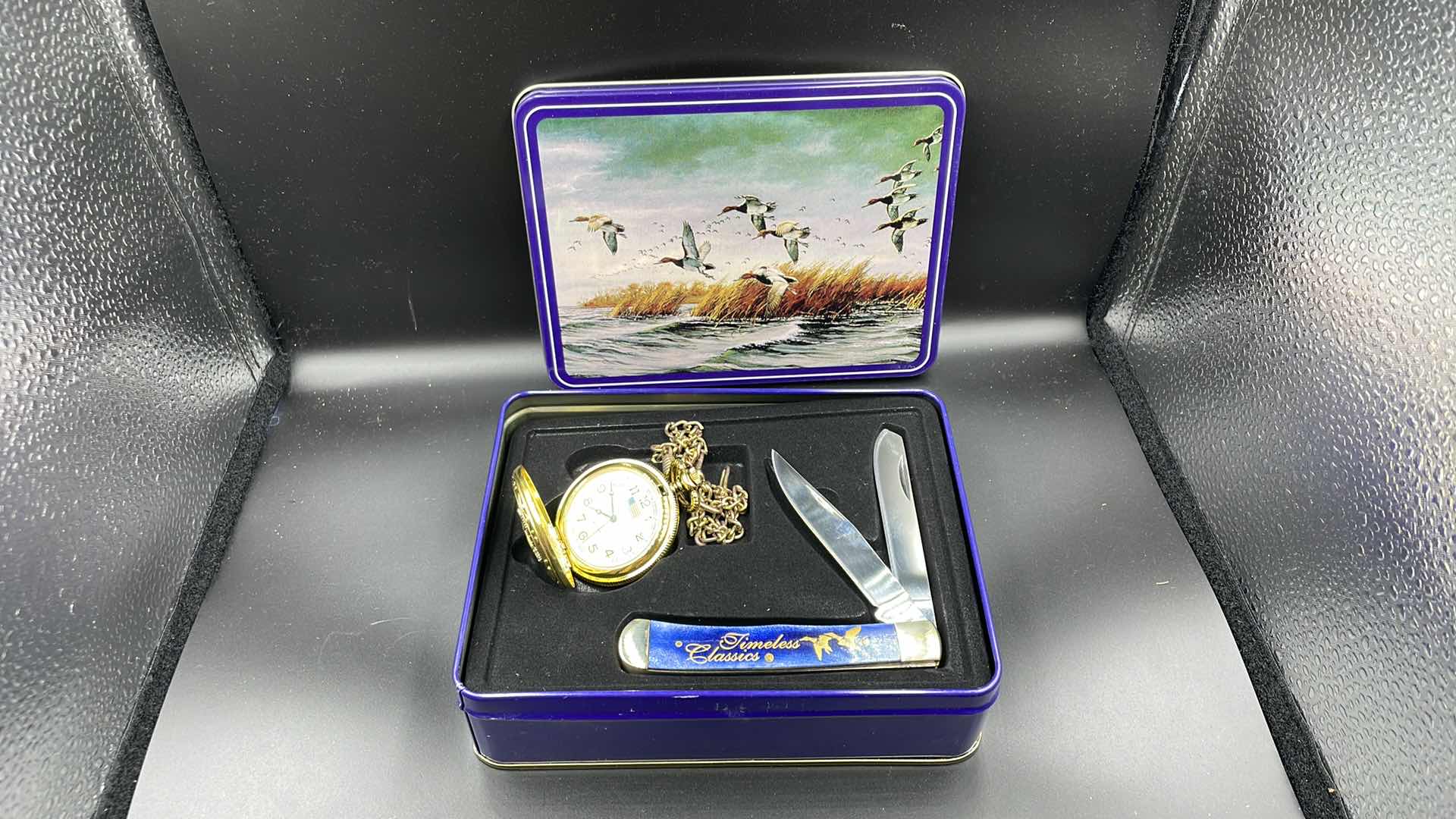 Photo 2 of DECORATIVE DUCK TIN POCKET WATCH AND POCKET KNIFE 6”