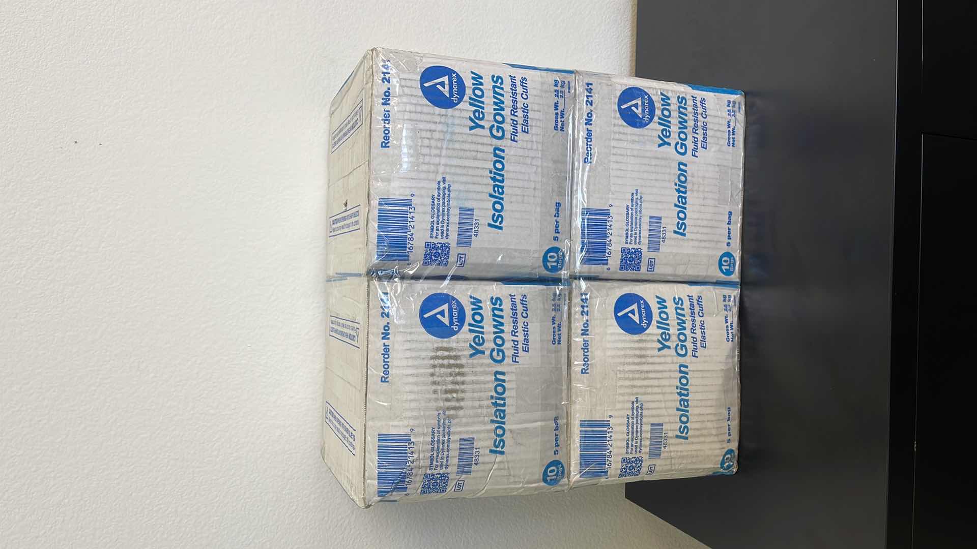 Photo 1 of 4 BOXES OF YELLOW FLUID RESISTANT ISOLATION GOWNS W ELASTIC CUFFS (50 PER BOX)